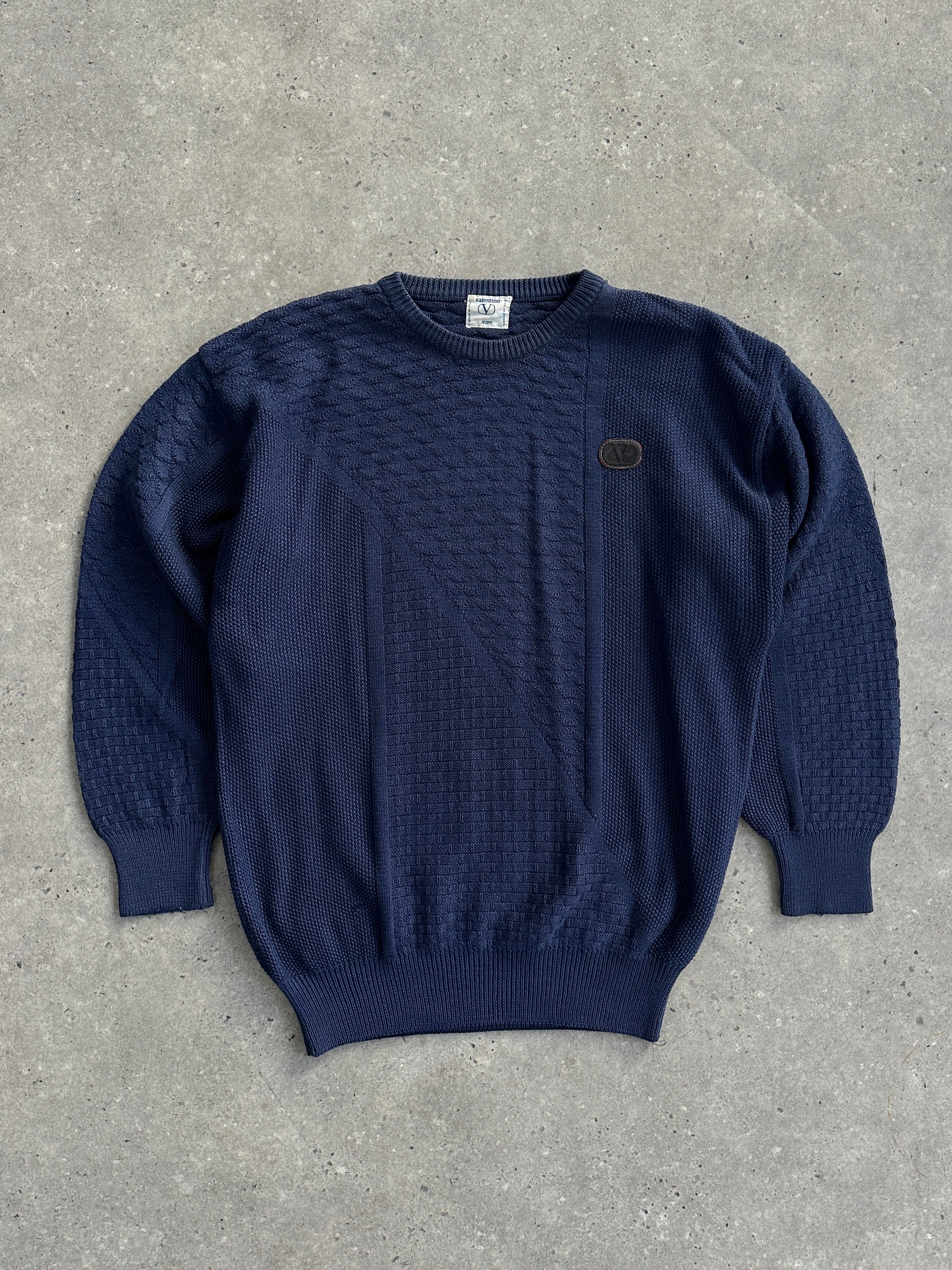Valentino 1990s cotton cable knit logo jumper in M/L, featuring classic knit pattern and brand logo on the front.