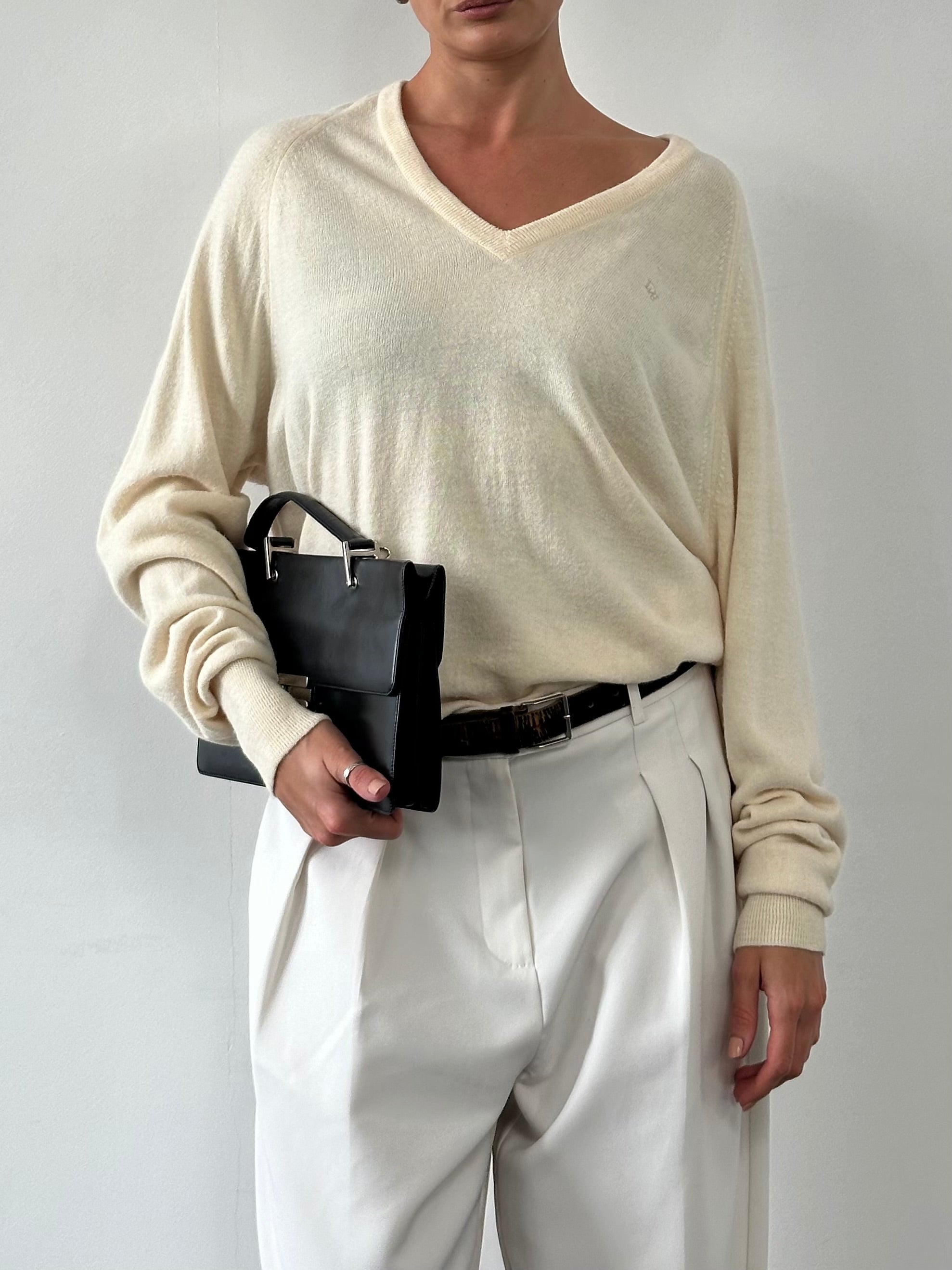 Christian Dior 1980s V-neck logo knitted jumper in size L/XL, featuring a classic design with the Dior logo on the front.