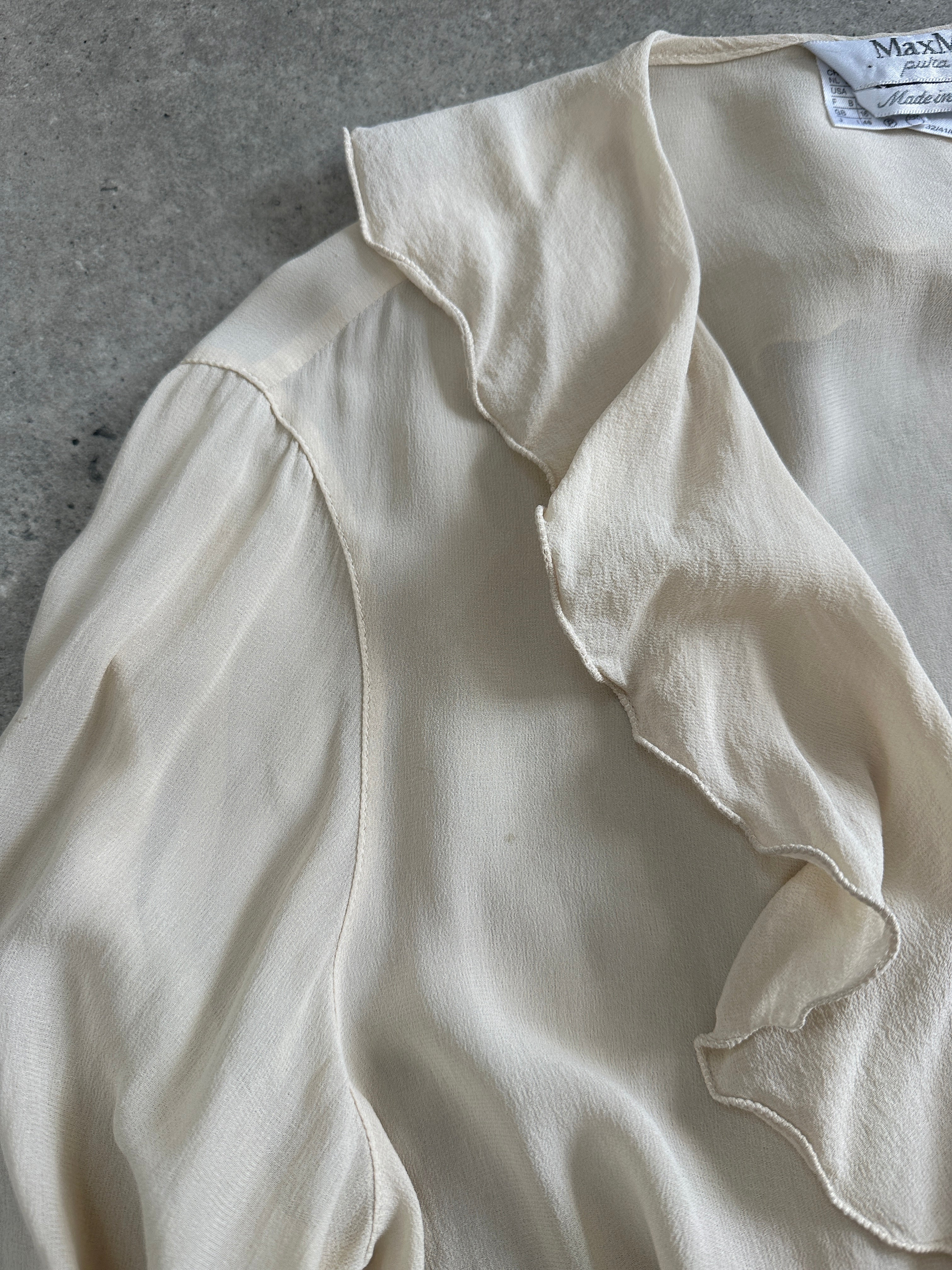 Max Mara pure silk frill wrap blouse in size L, featuring delicate ruffles and elegant design, shown on a mannequin.