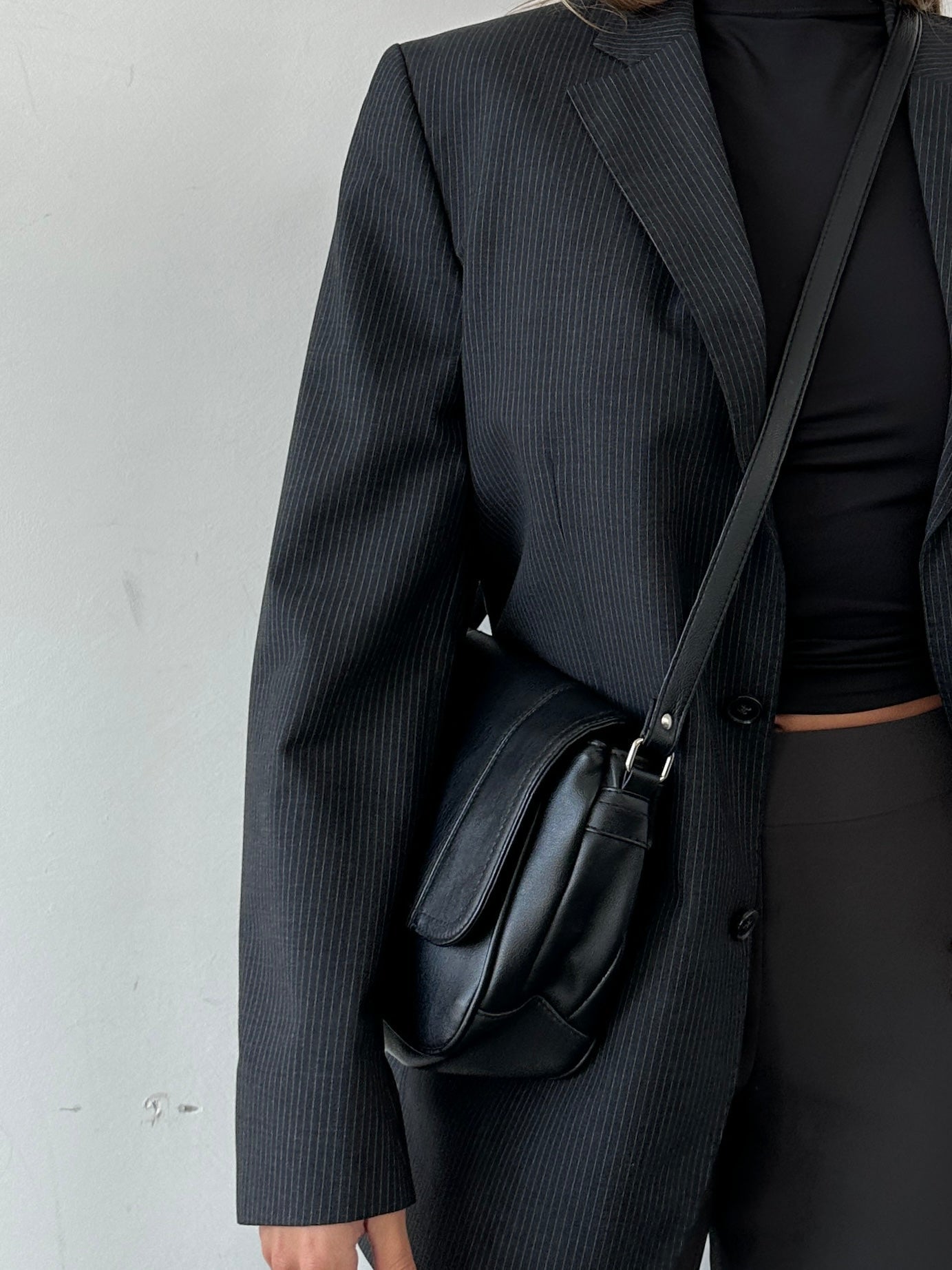 Vintage Faux Leather Crossbody Bag featuring a classic design with adjustable strap and sleek finish.