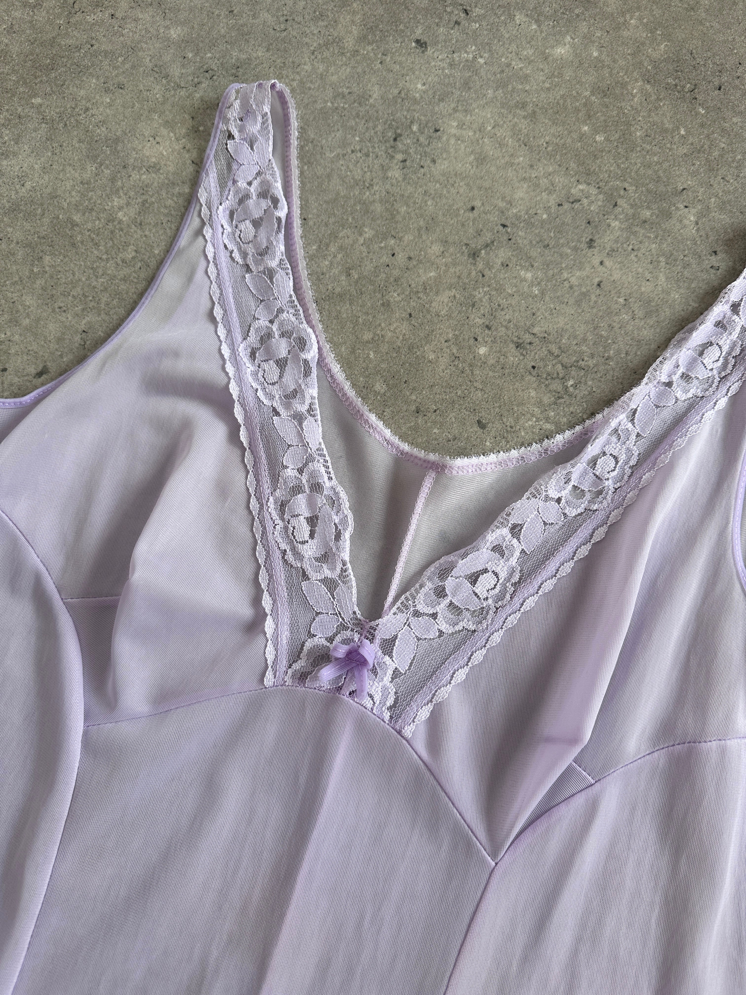 Vintage 2000s lace sheer midi slip dress in size large, featuring delicate fabric and classic vintage style.