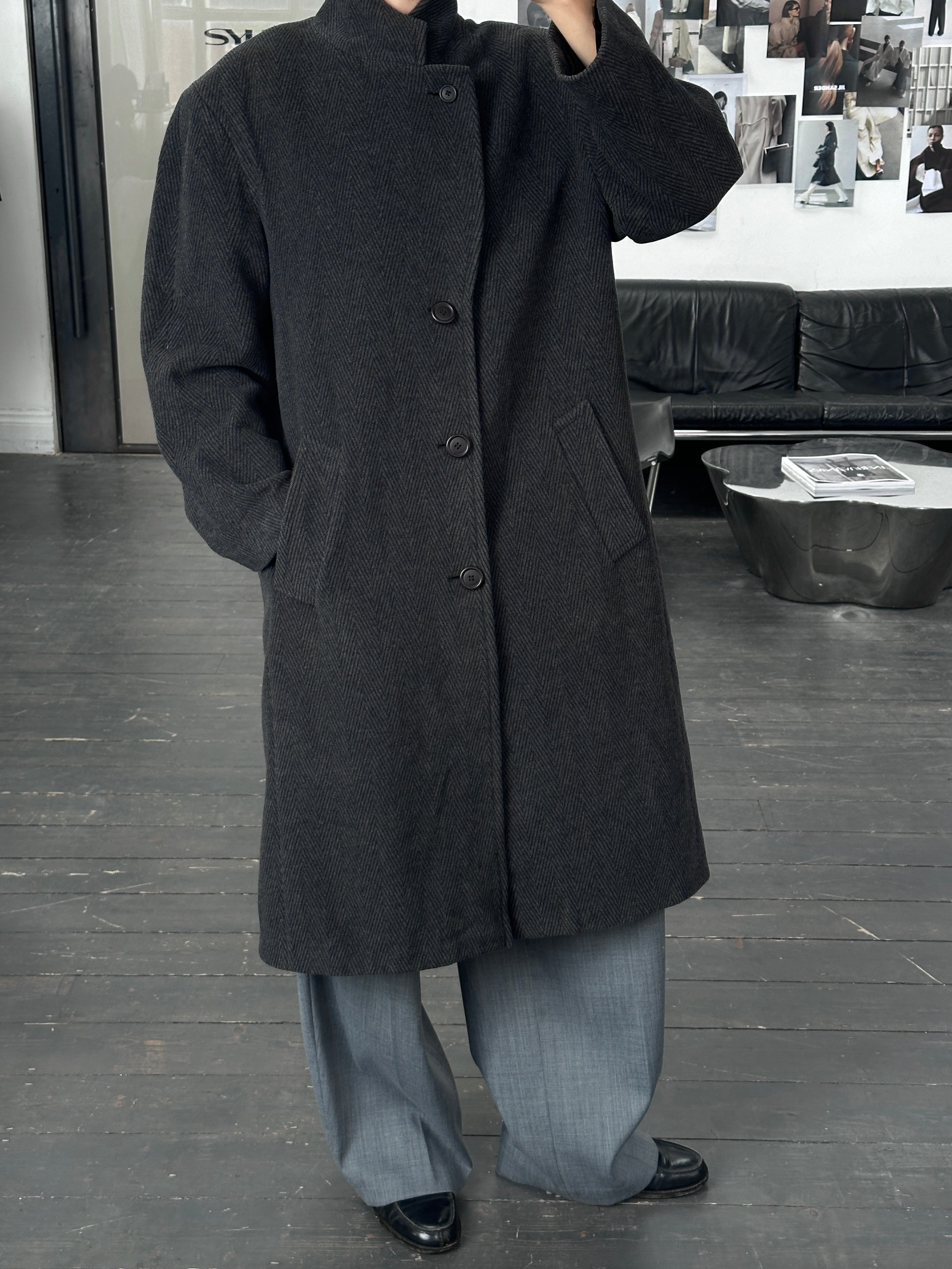 Vintage Italian 1980s wool and cashmere herringbone coat in XL size, showcasing classic textured fabric and tailored design.
