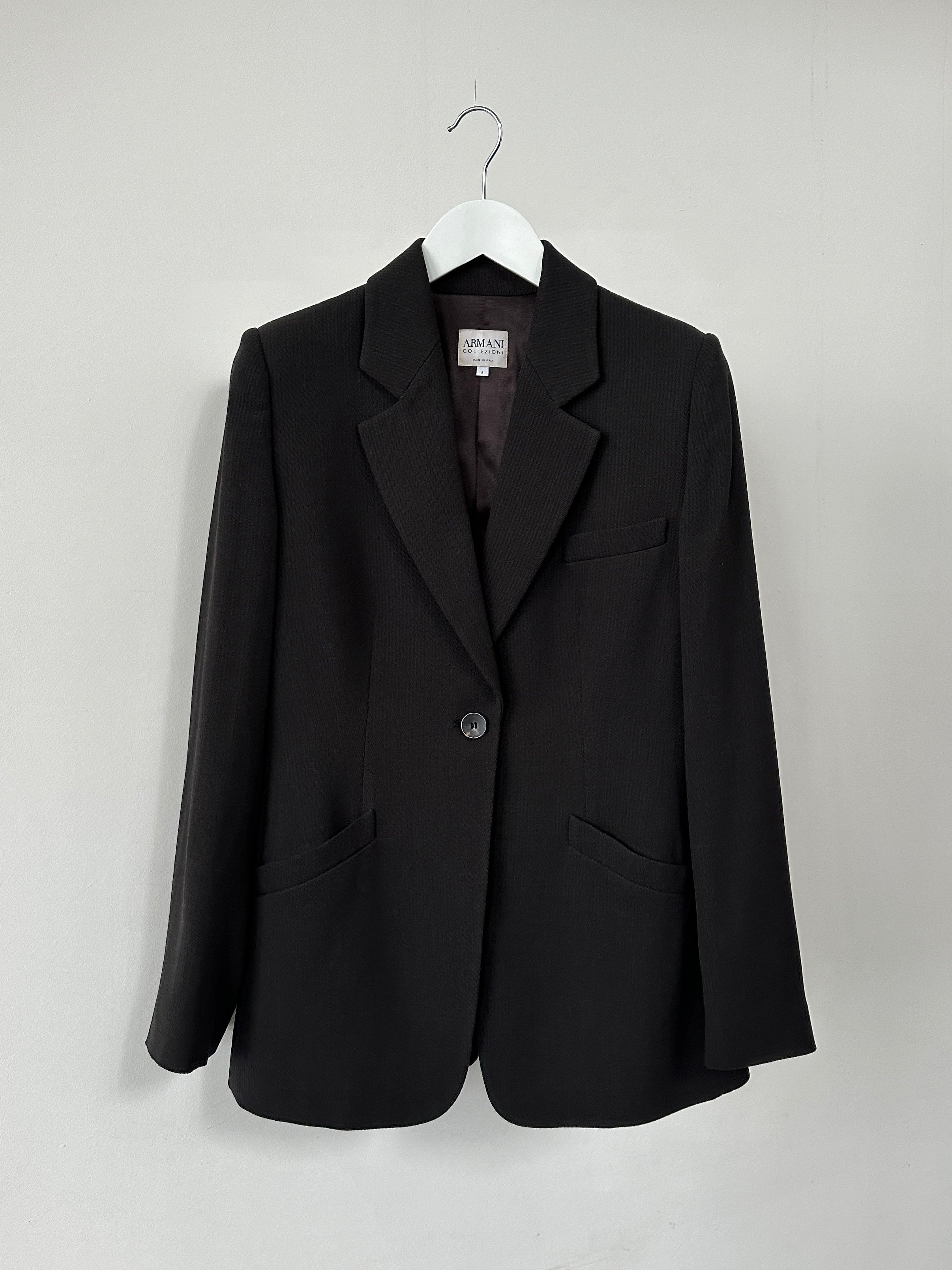 Armani Collezioni single button fitted blazer in classic dark fabric, tailored with a sleek lapel and structured fit.