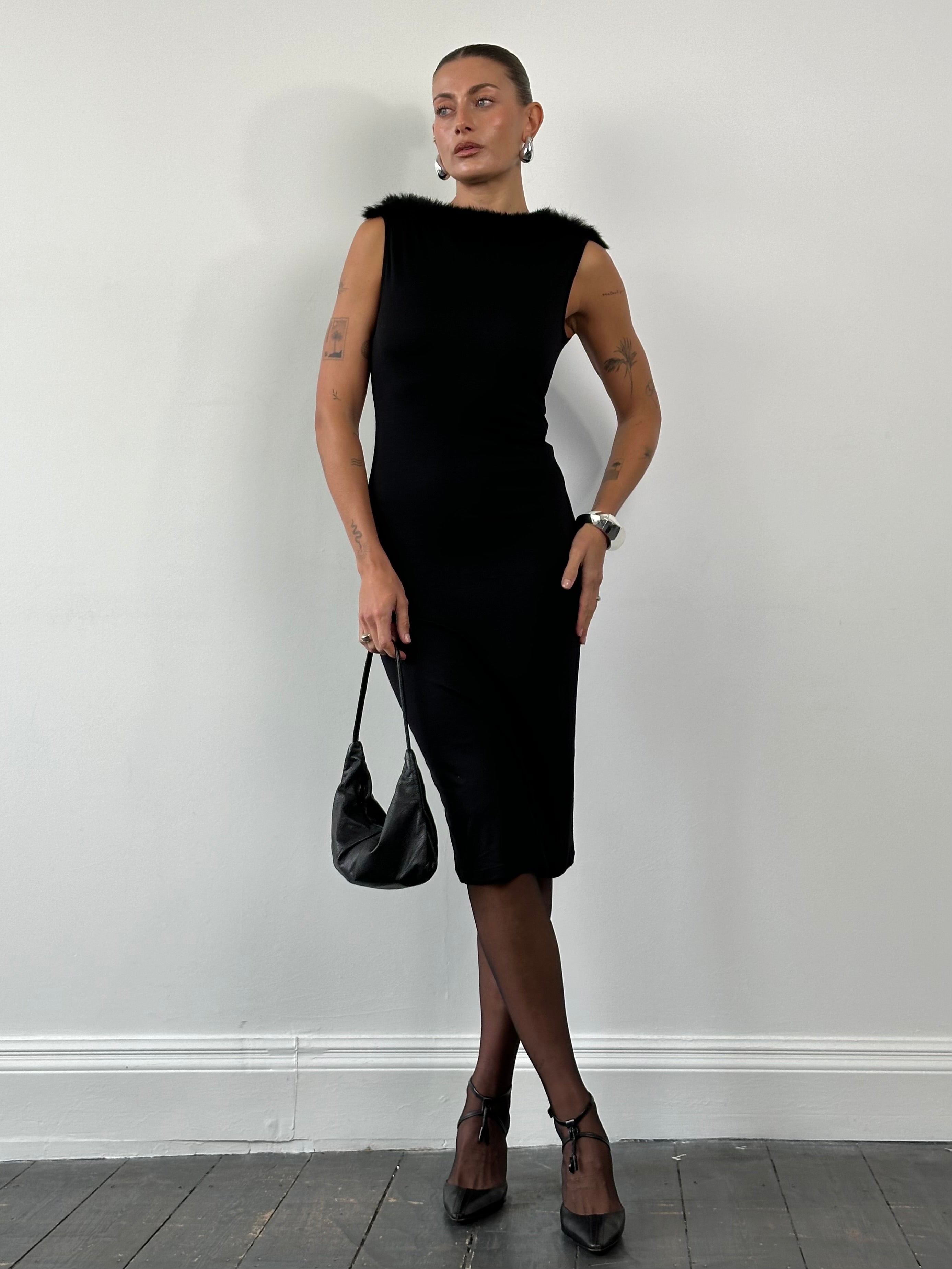 Moschino 1990s feather-trim boat neck midi dress in black, featuring a fitted silhouette and feather details, size S/M.