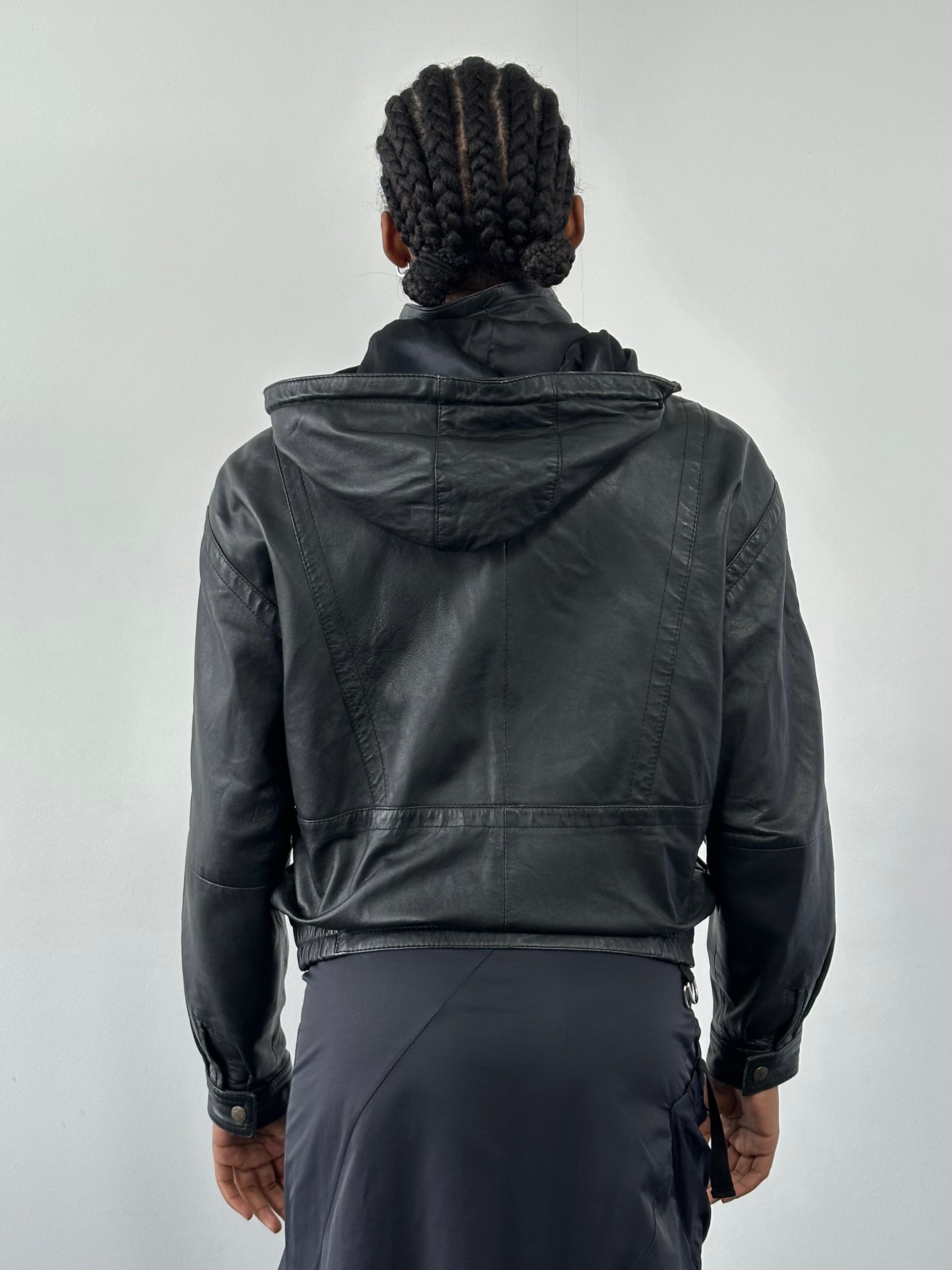 Vintage 1990s leather funnel neck hooded bomber jacket, size small, with classic design and durable leather material.