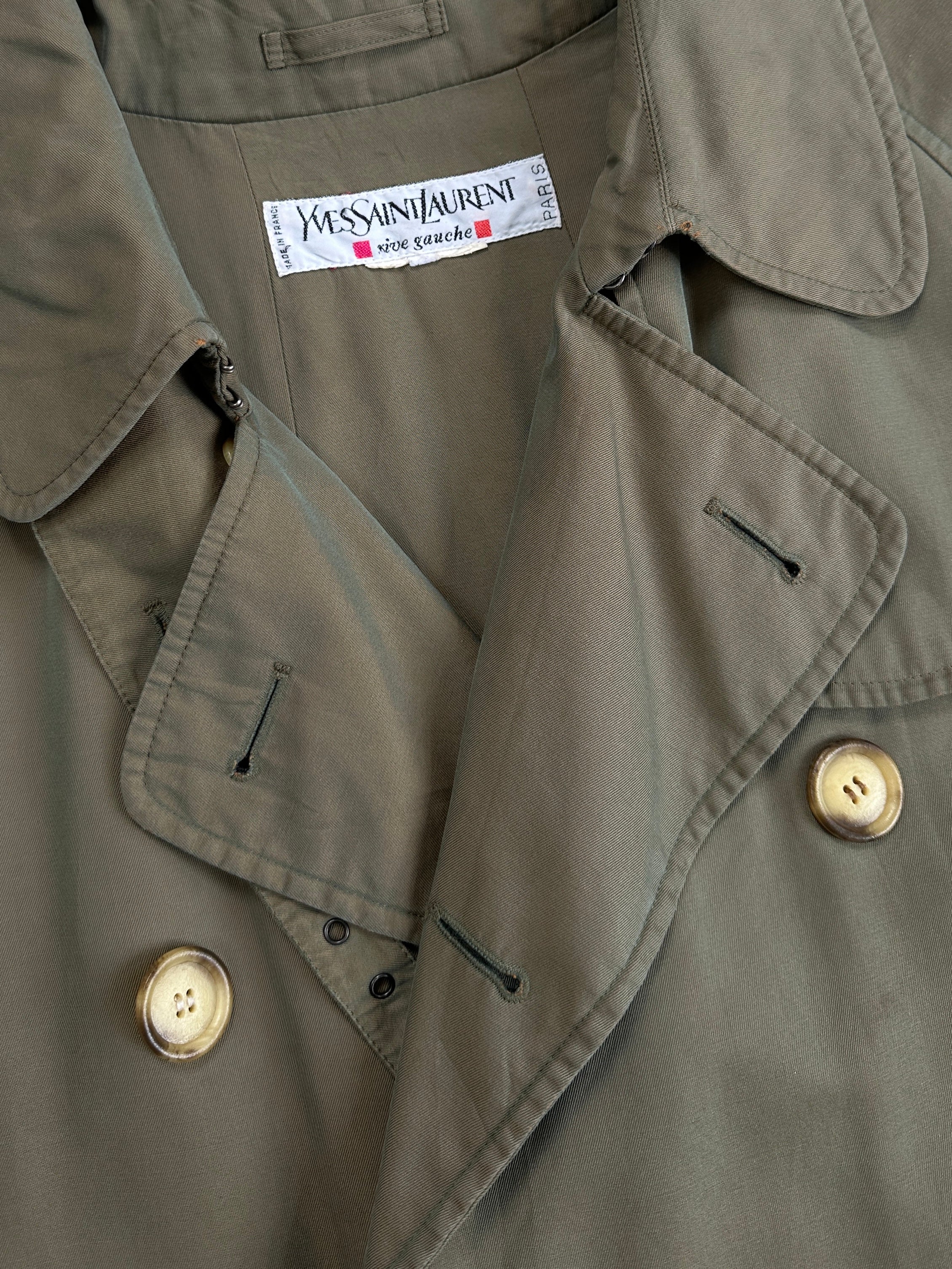 Yves Saint Laurent Rive Gauche 1980s double-breasted trench coat in classic beige, featuring wide lapels and a belted waist.