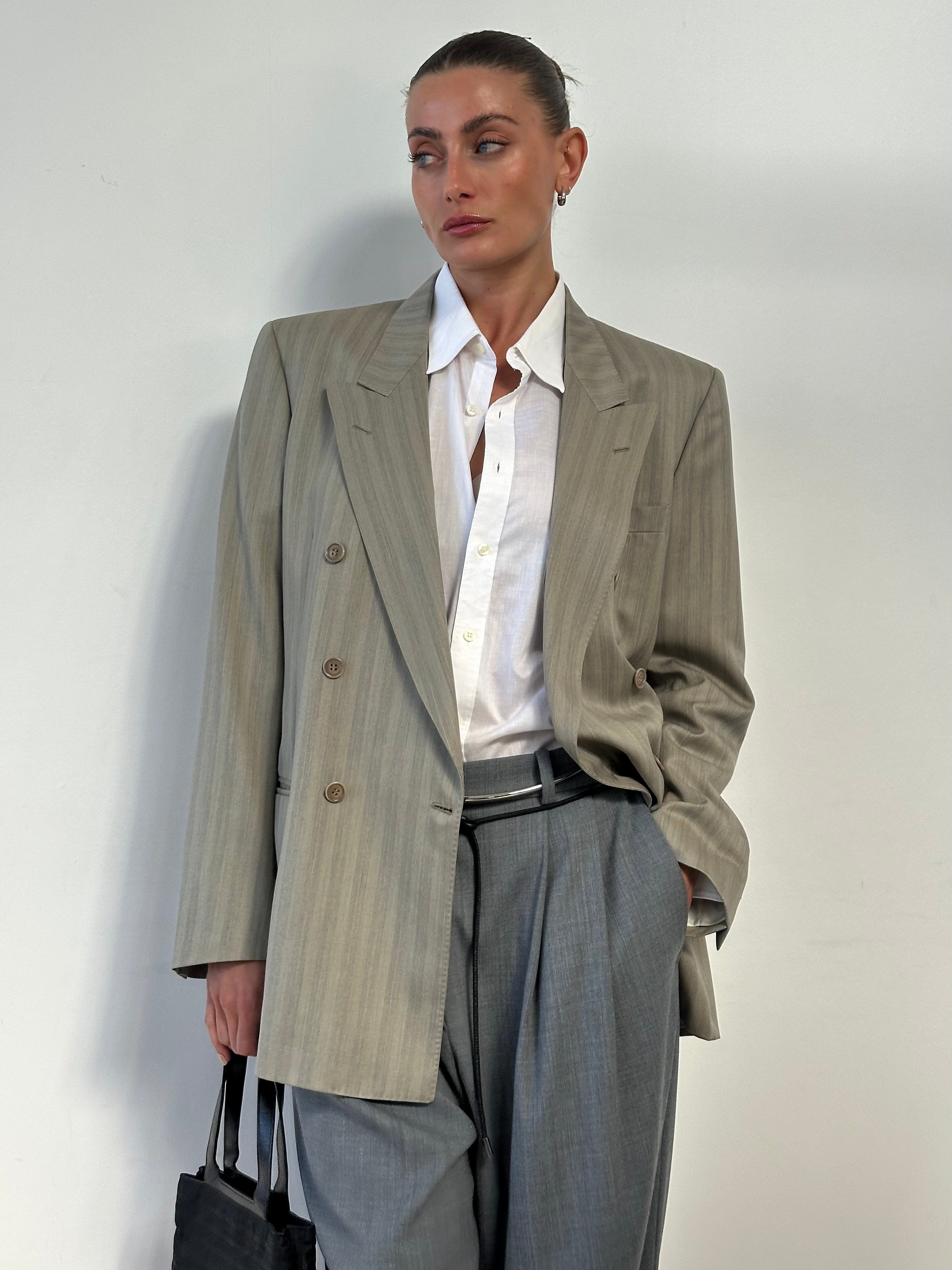 Vintage Italian vintage pure wool double-breasted blazer in size large, showing classic tailored fit and elegant lapel details.