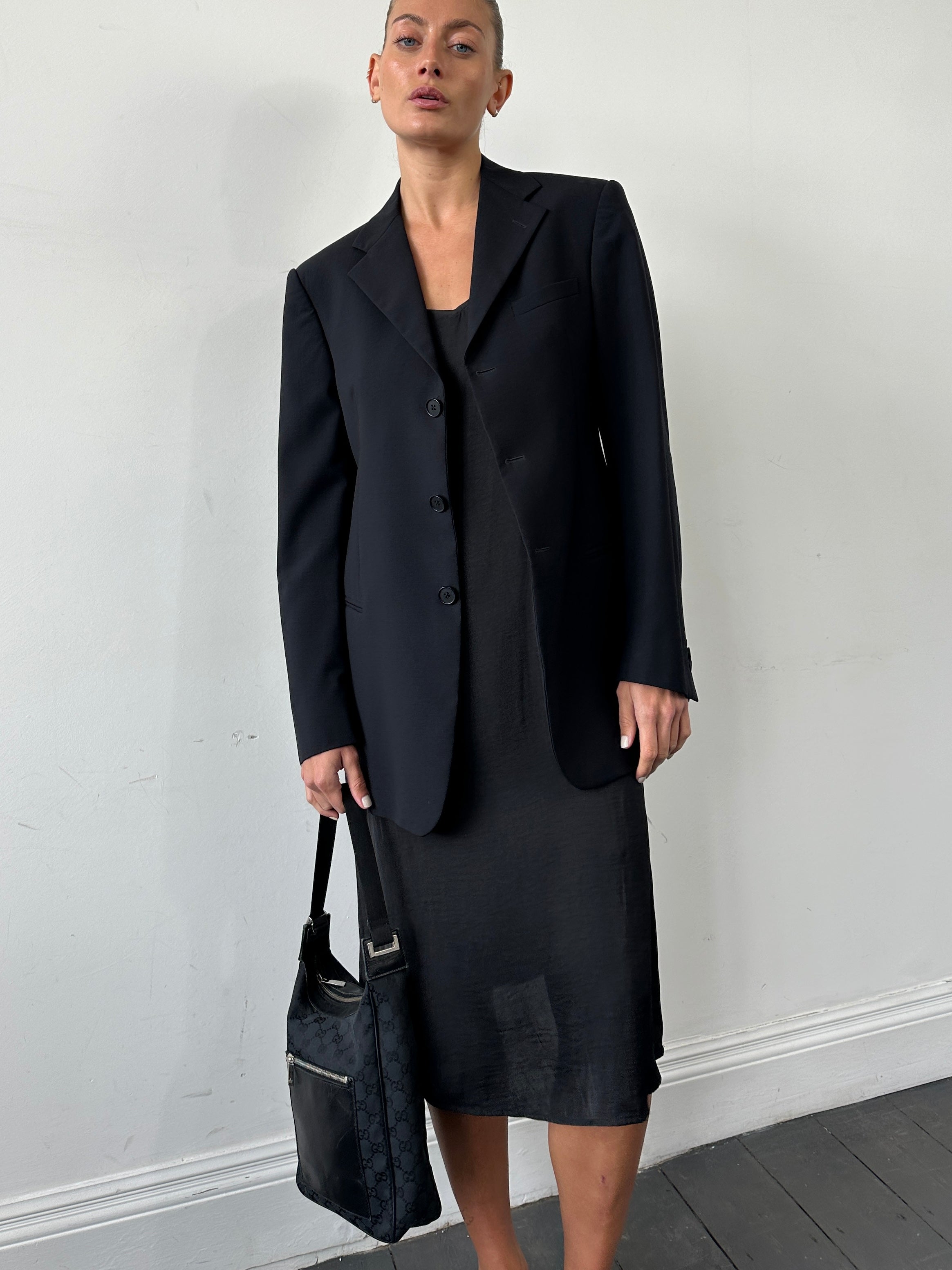 Emporio Armani wool single-breasted blazer in size 38R/M, tailored fit with classic notch lapel and front button closures.