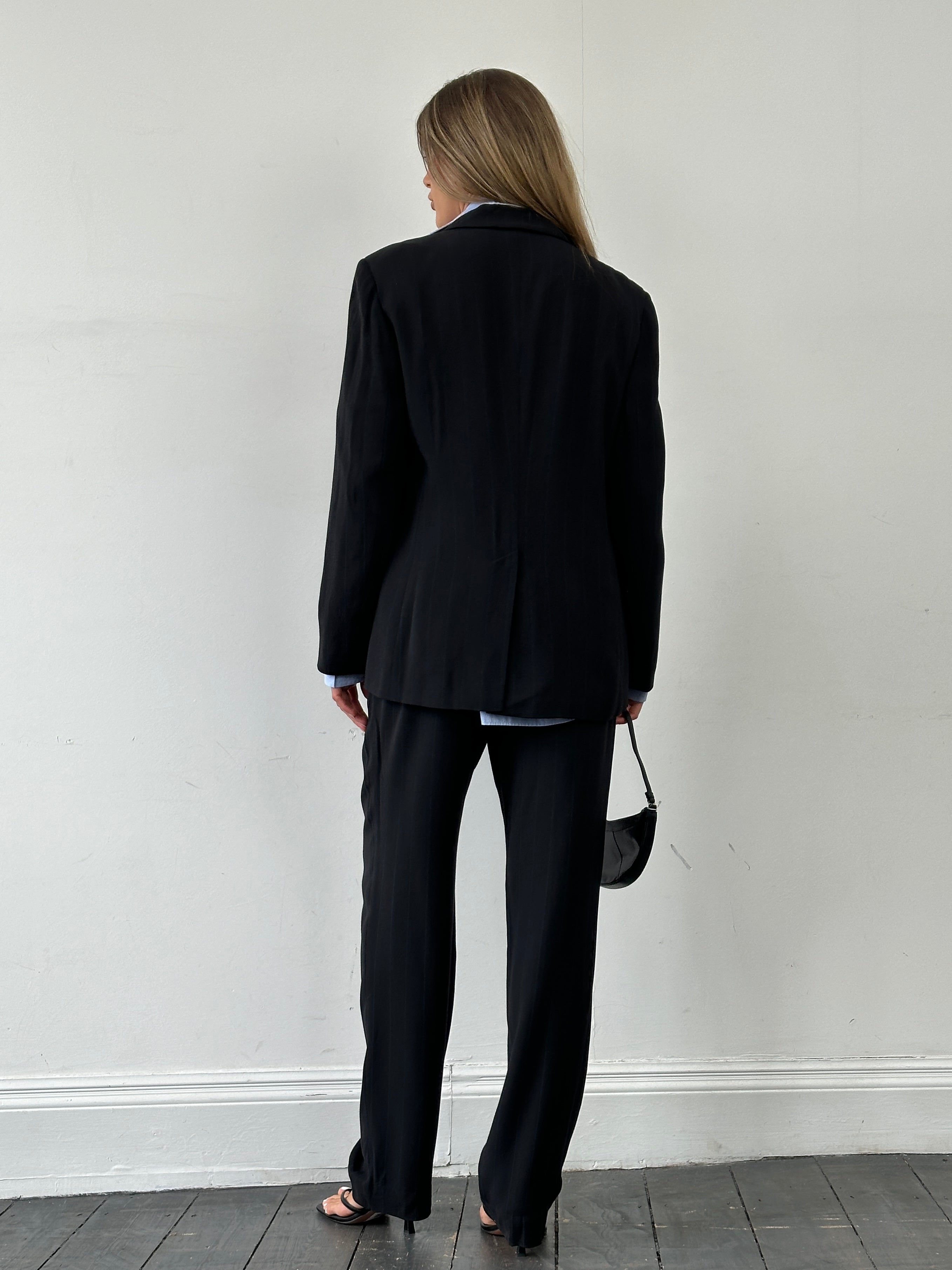 Marella stipe single-breasted virgin wool blend jumpsuit in dark color, featuring a tailored fit and structured design.