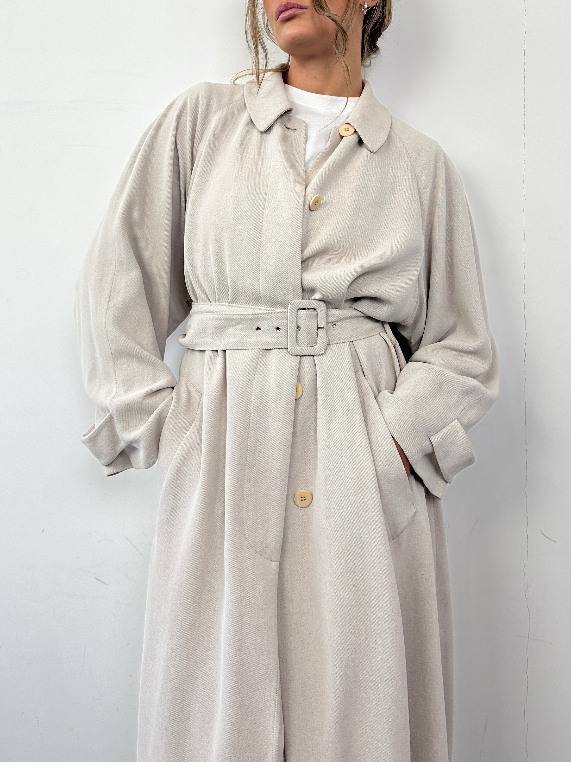 Giorgio Armani Le Collezioni wool floor-length belted coat in black, showcasing a tailored design with a belt at the waist.