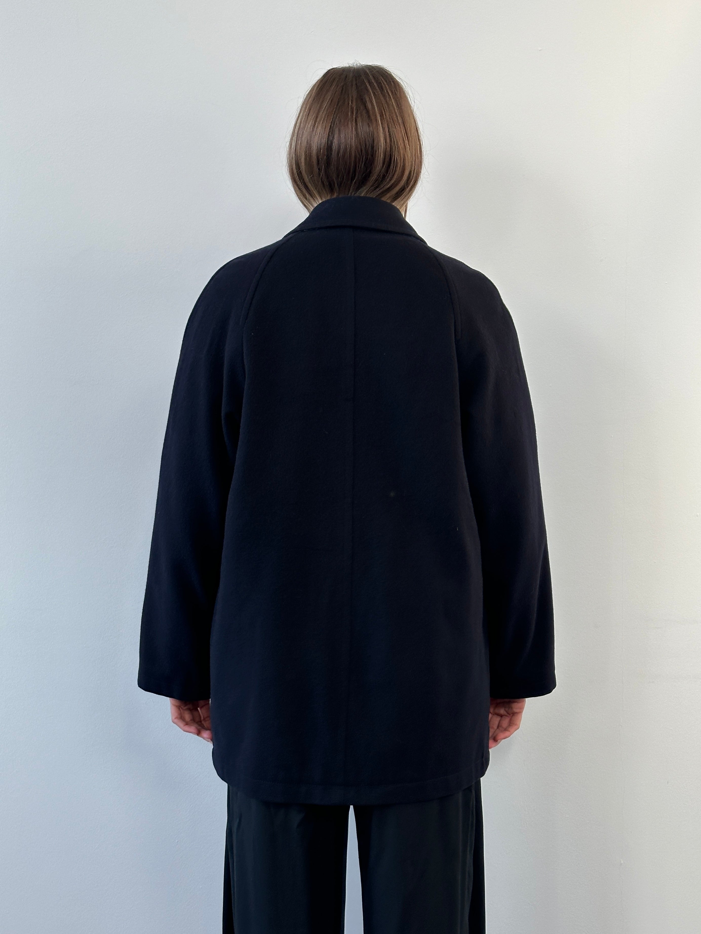 Burberry London 1990s wool single-breasted logo coat in size L/XL, featuring classic design and signature check pattern.