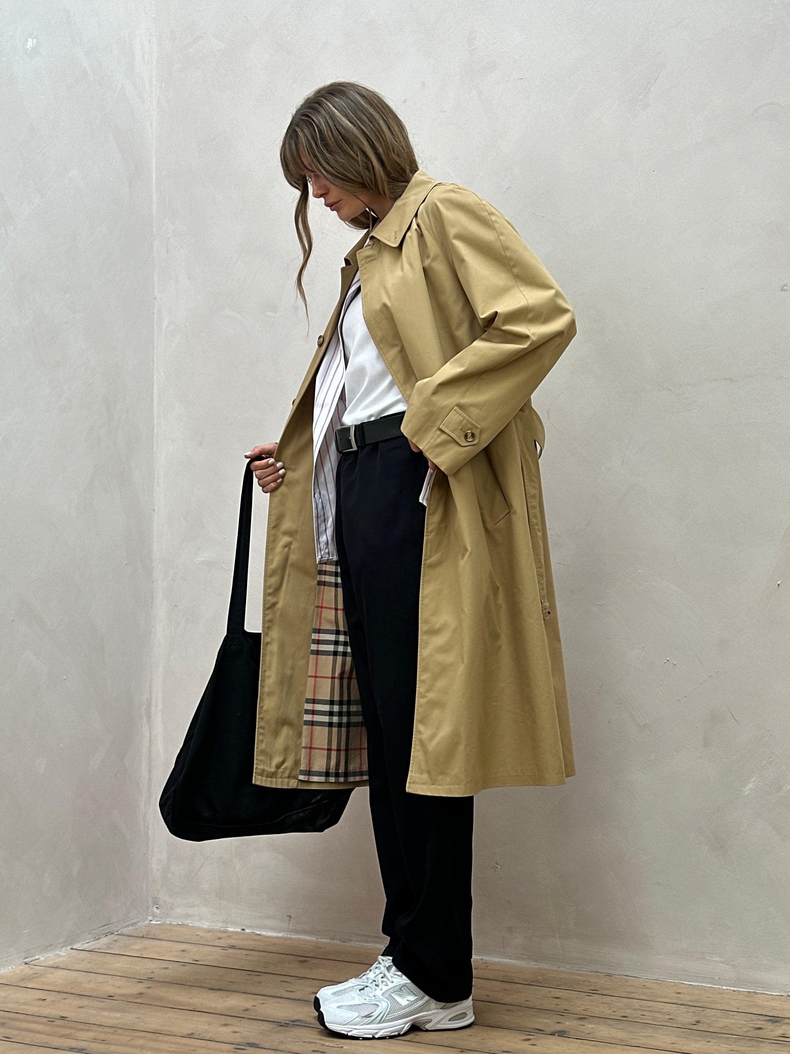 Vintage XL trench coat with concealed placket, belted waist, and classic style, shown in a neutral fabric and design.
