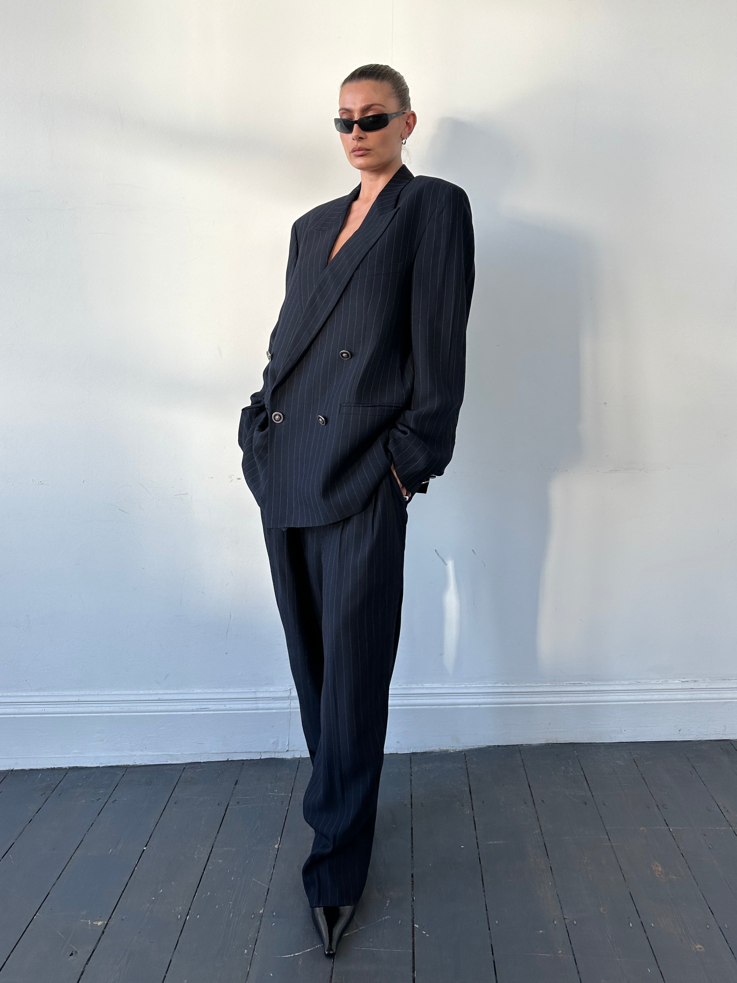 Versace Versus 1990s pinstripe bespoke double-breasted suit in size 44L/W34, tailored with classic style and sharp lapels.