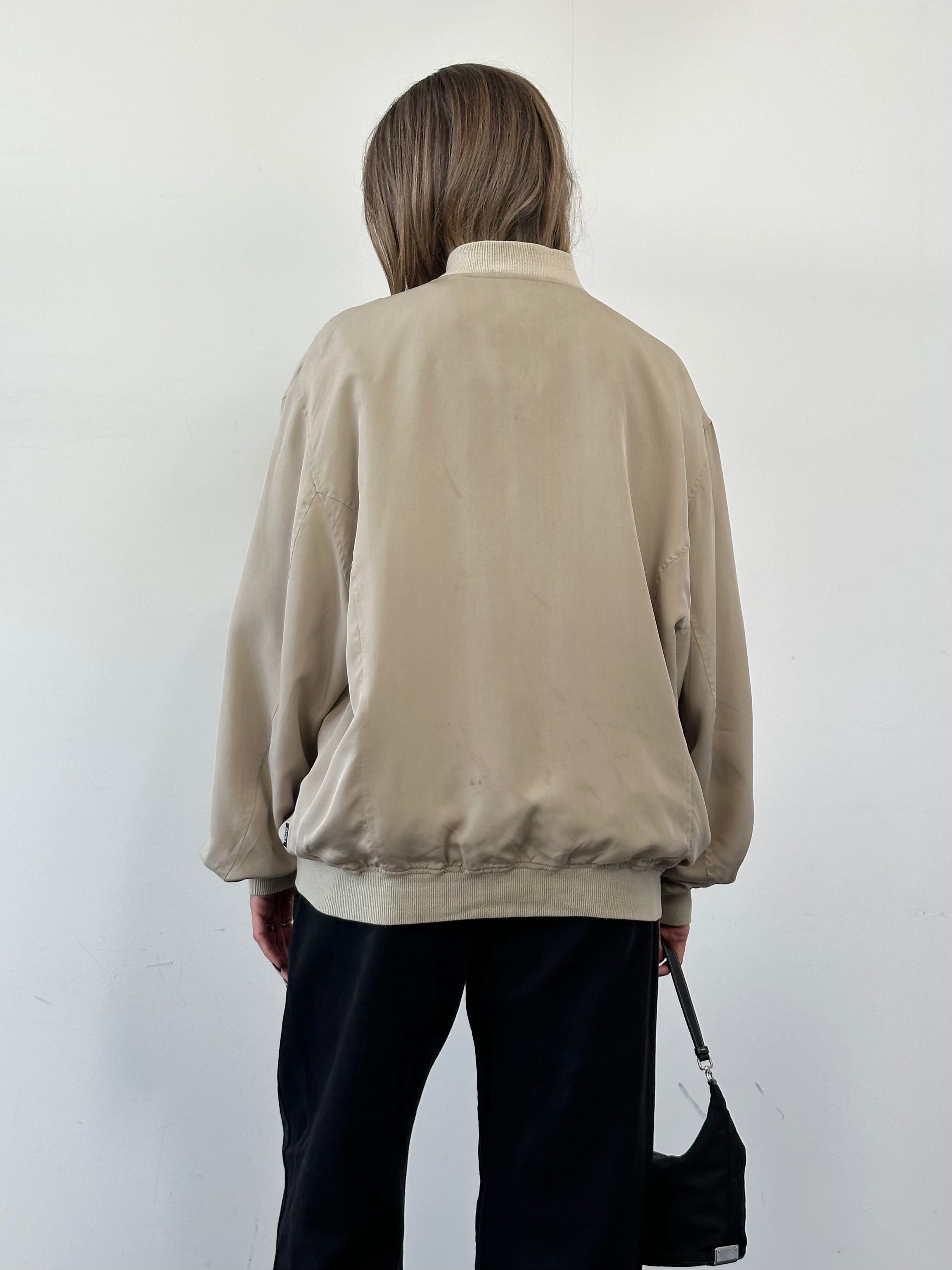 Vintage pure silk bomber jacket in XL, featuring a classic design with a smooth, shiny finish and ribbed collar and cuffs.