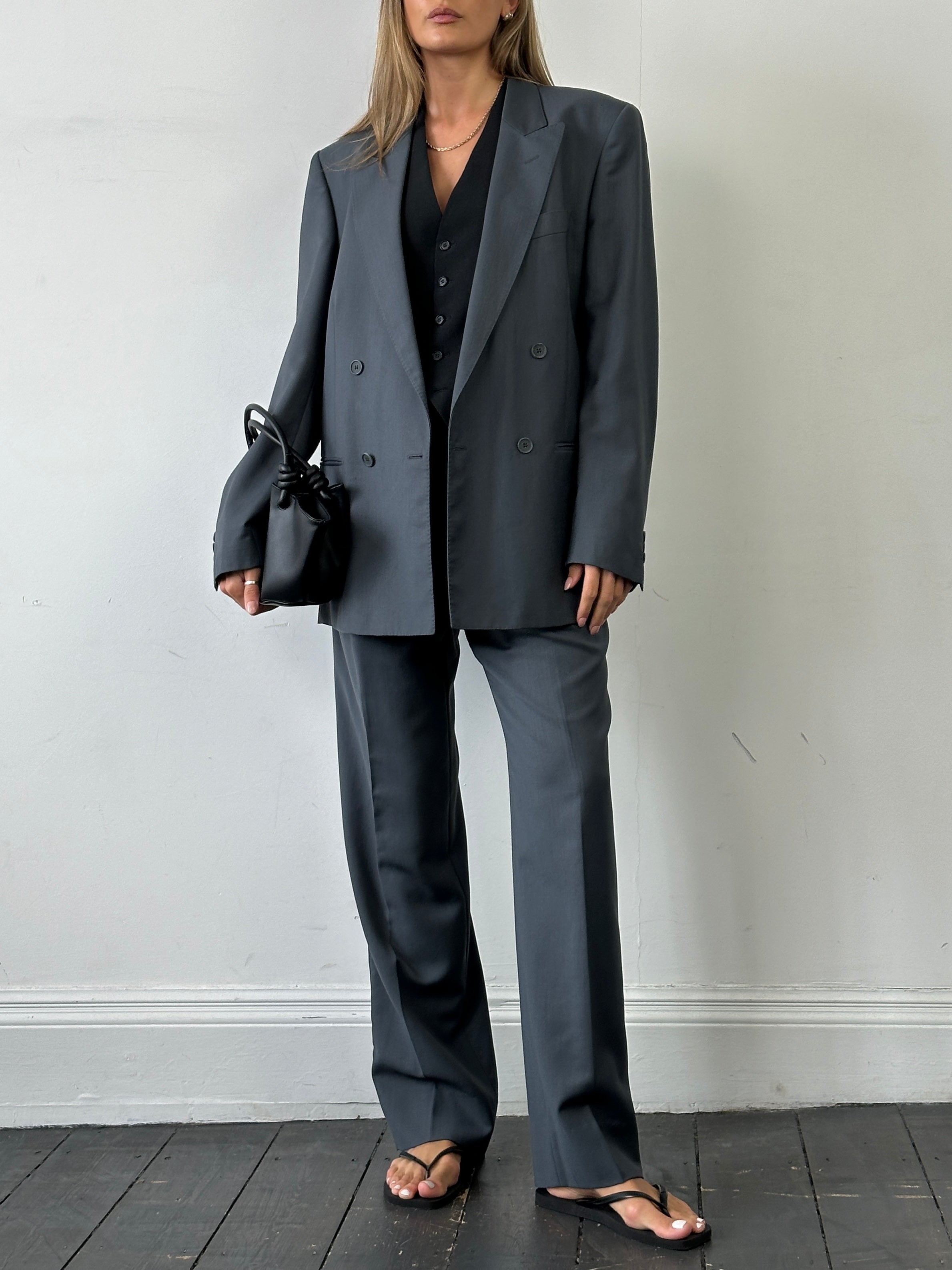Vintage Italian double-breasted wool blazer in size 40R/W28, classic tailored suit jacket with lapel collar and button details.