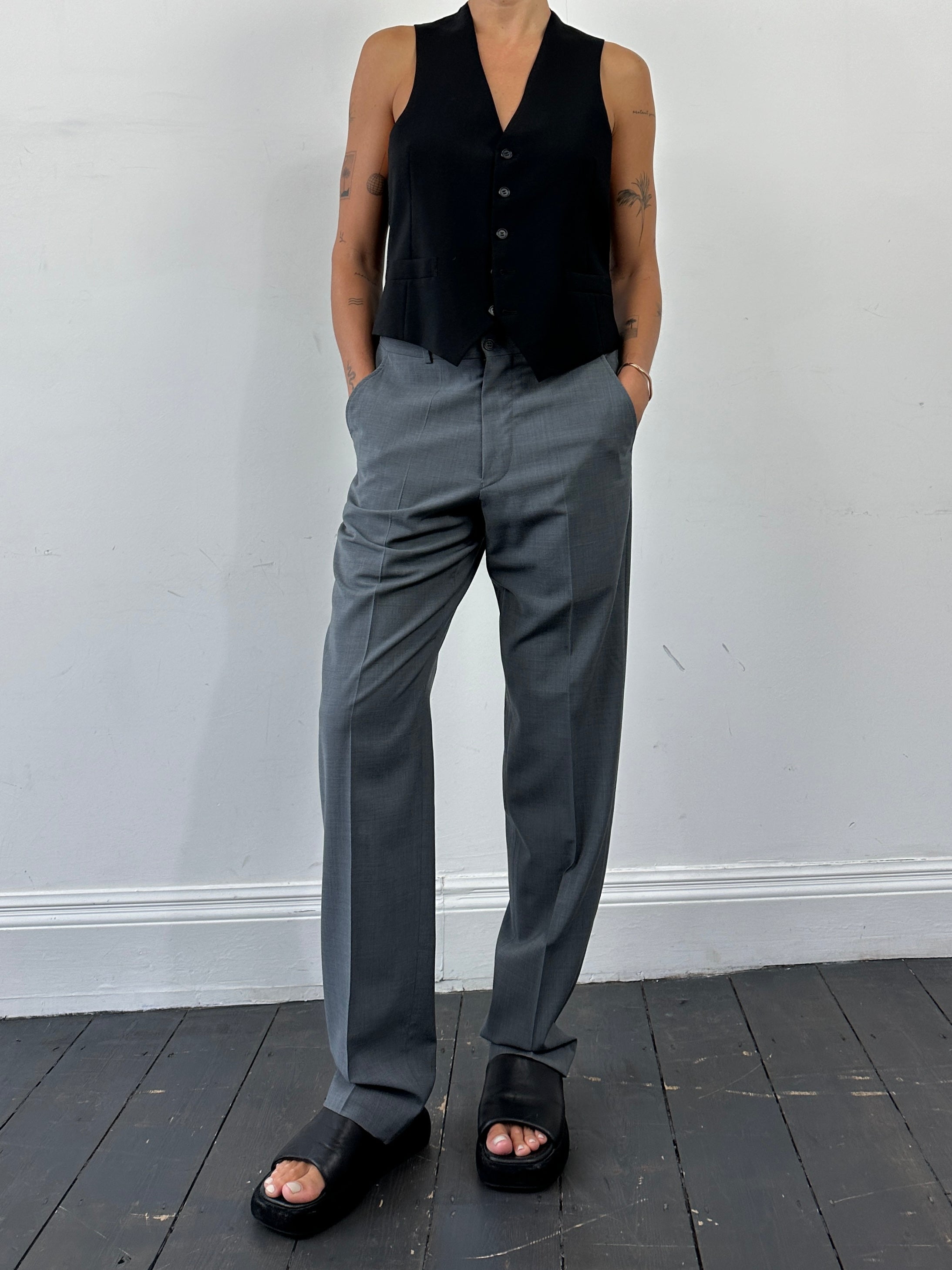 Emporio Armani high waisted tailored wool trousers in classic dark color, front view showing sleek design and tailored fit.