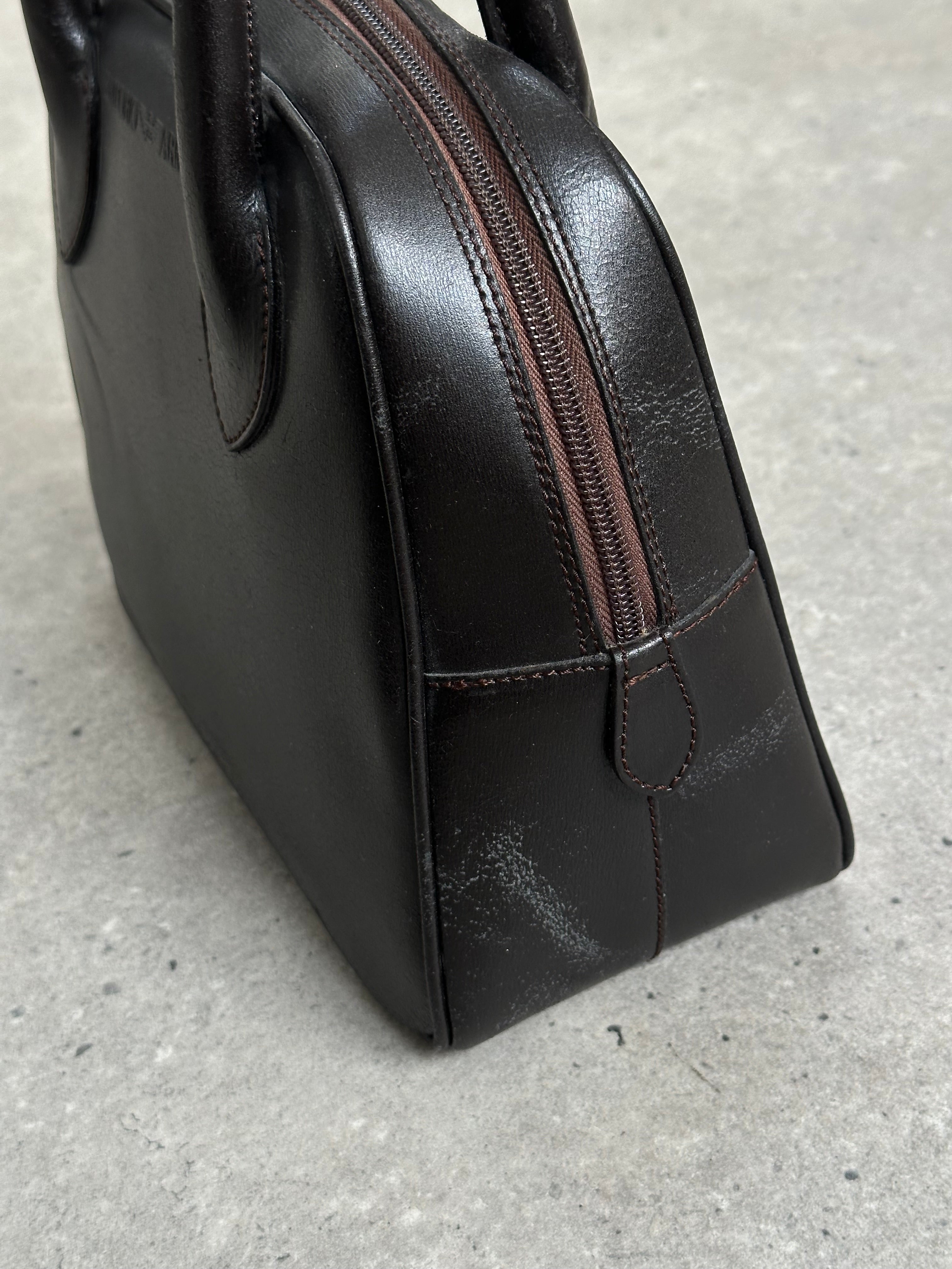 Emporio Armani leather handbag from the 2000s with sleek design, featuring a structured shape and elegant detailing.