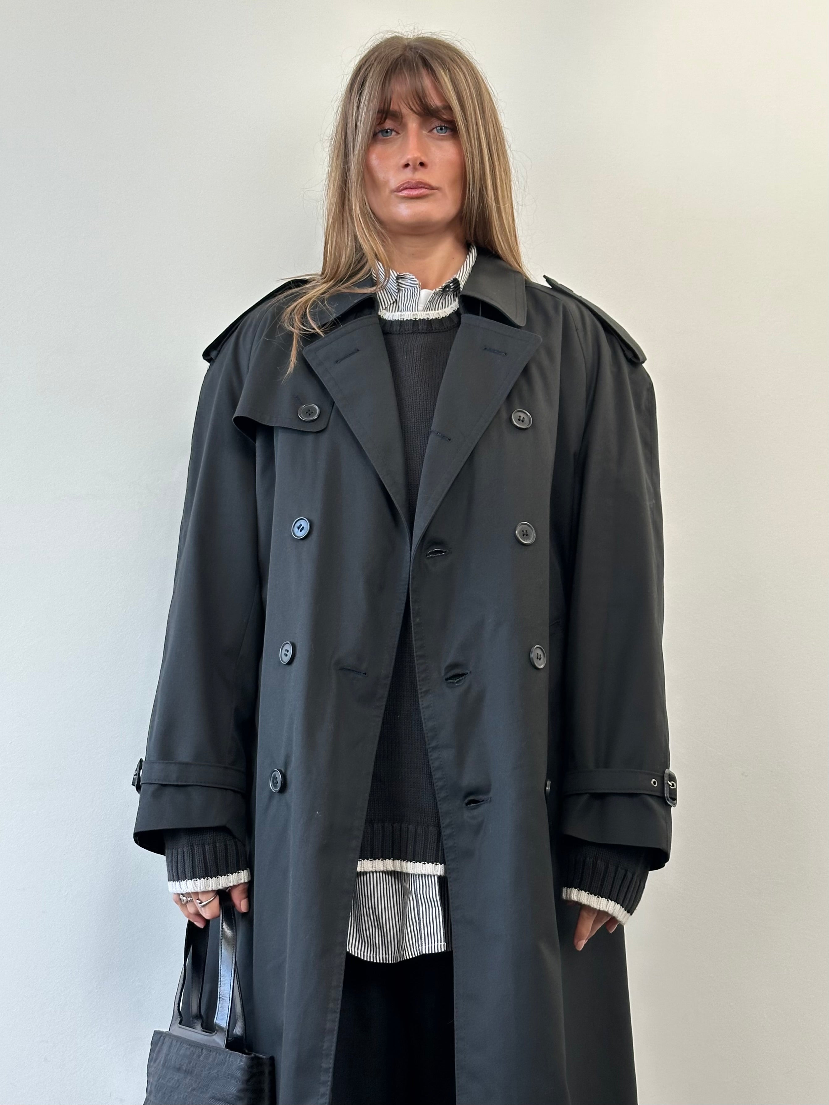 Vintage double-breasted floor-length belted trench coat in size XL, featuring classic style and timeless design.
