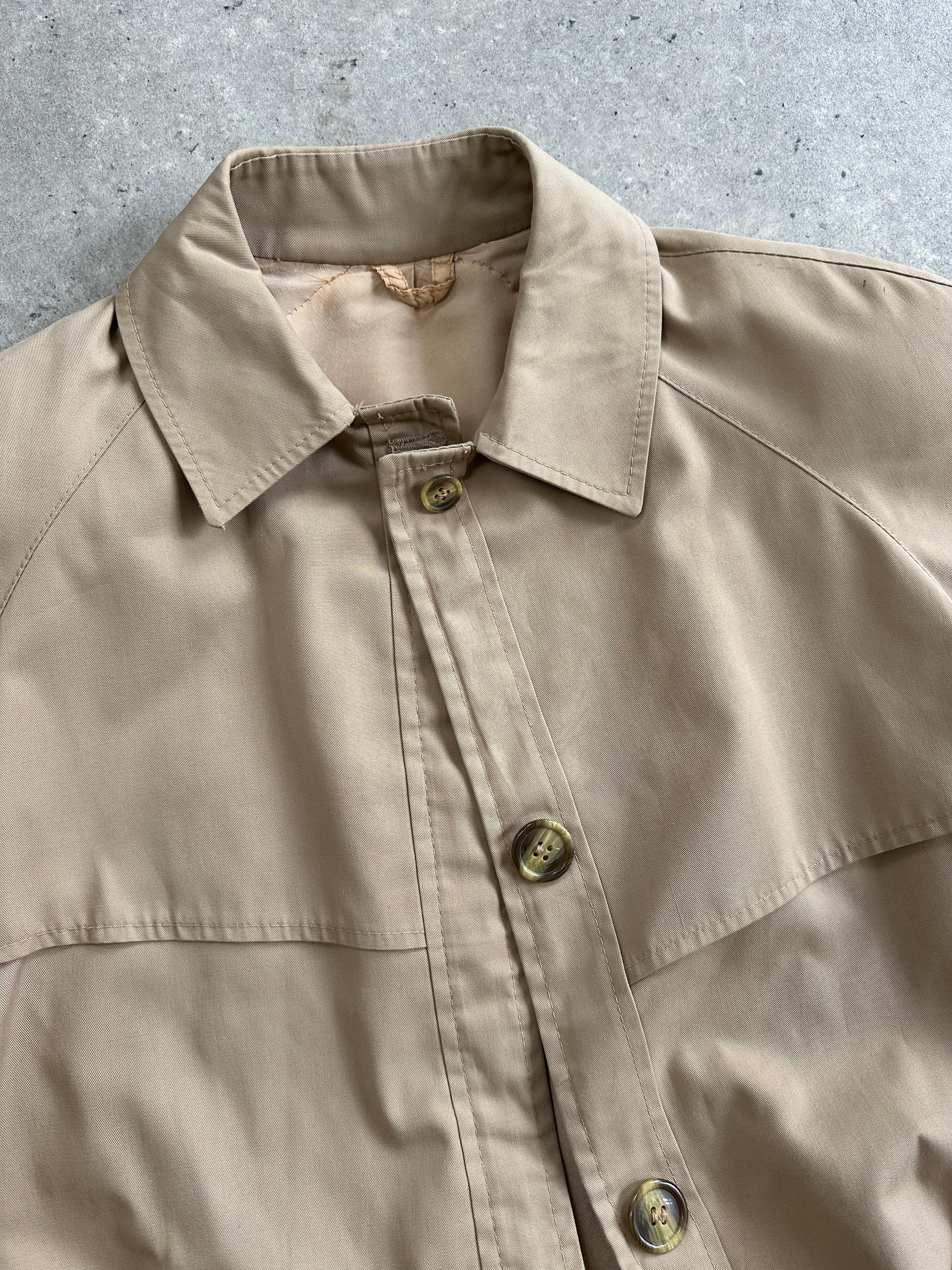 Vintage Italian vintage cotton single-breasted trench coat in size S, shown in beige with classic collar and button details.