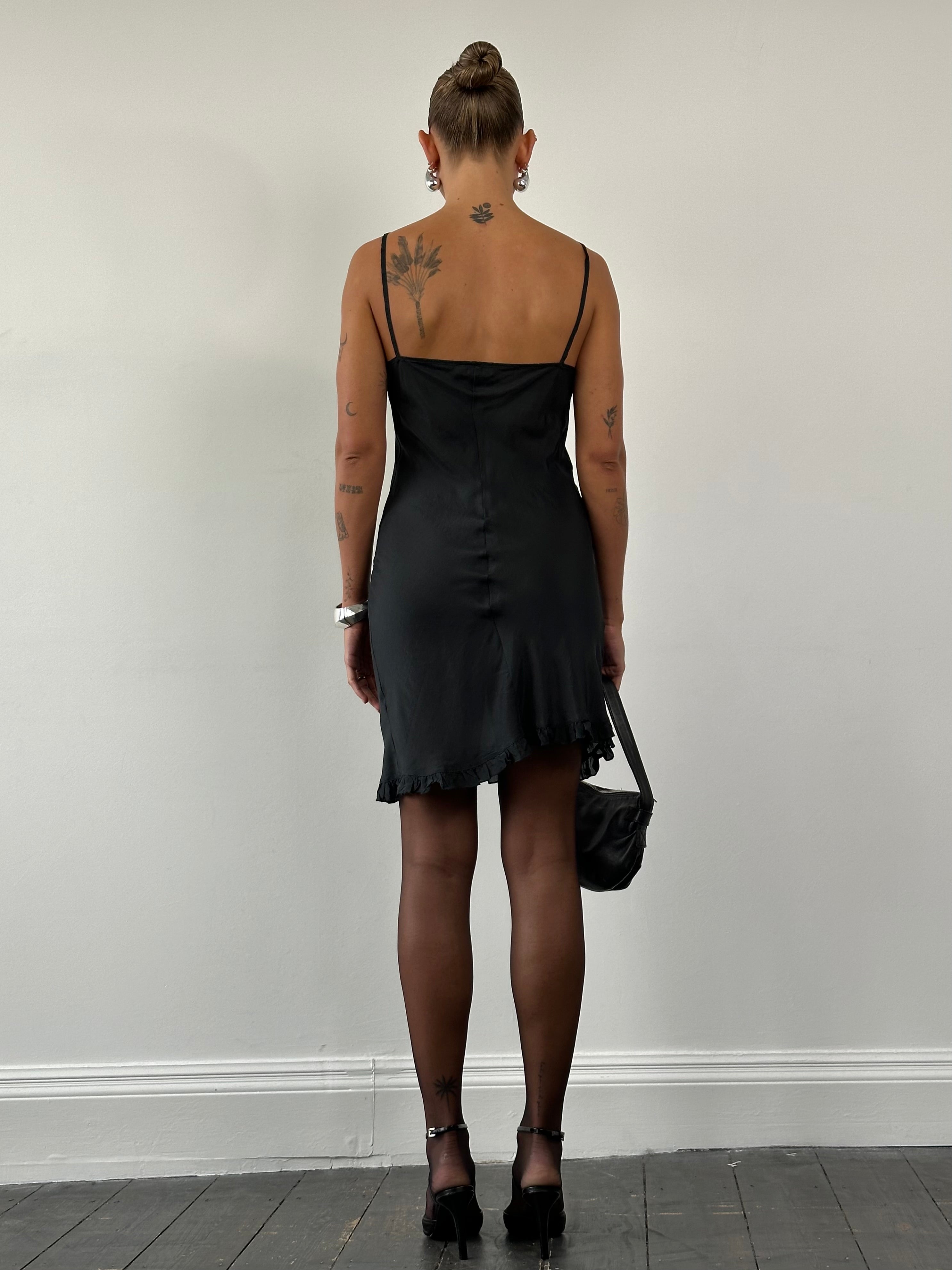 Vintage Italian pure silk sheer mini slip dress in size small, featuring a delicate, flowing design and elegant vintage style.