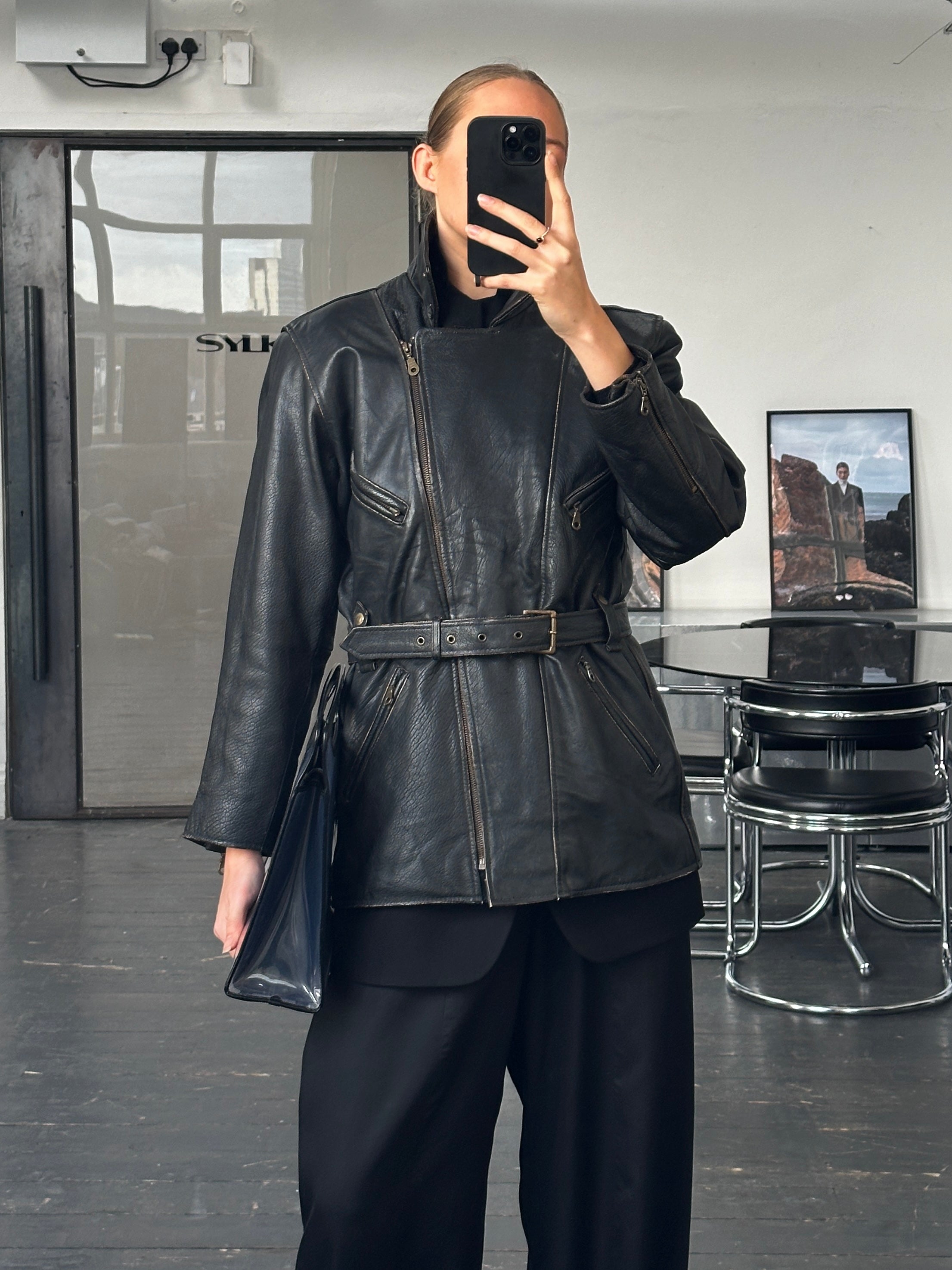 Vintage 1980s aviator belted leather jacket, front view showing classic design, brown leather with belt detailing and vintage style.