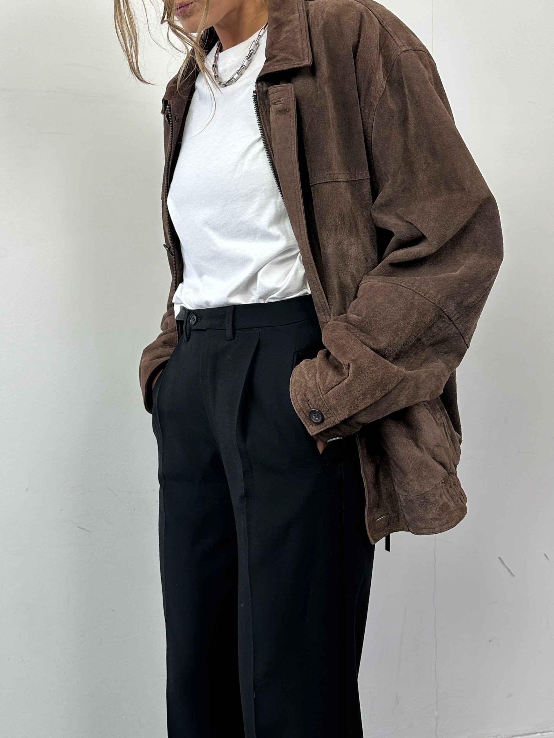 Vintage brand vintage suede leather bomber jacket in size L, featuring classic design and distressed brown finish.