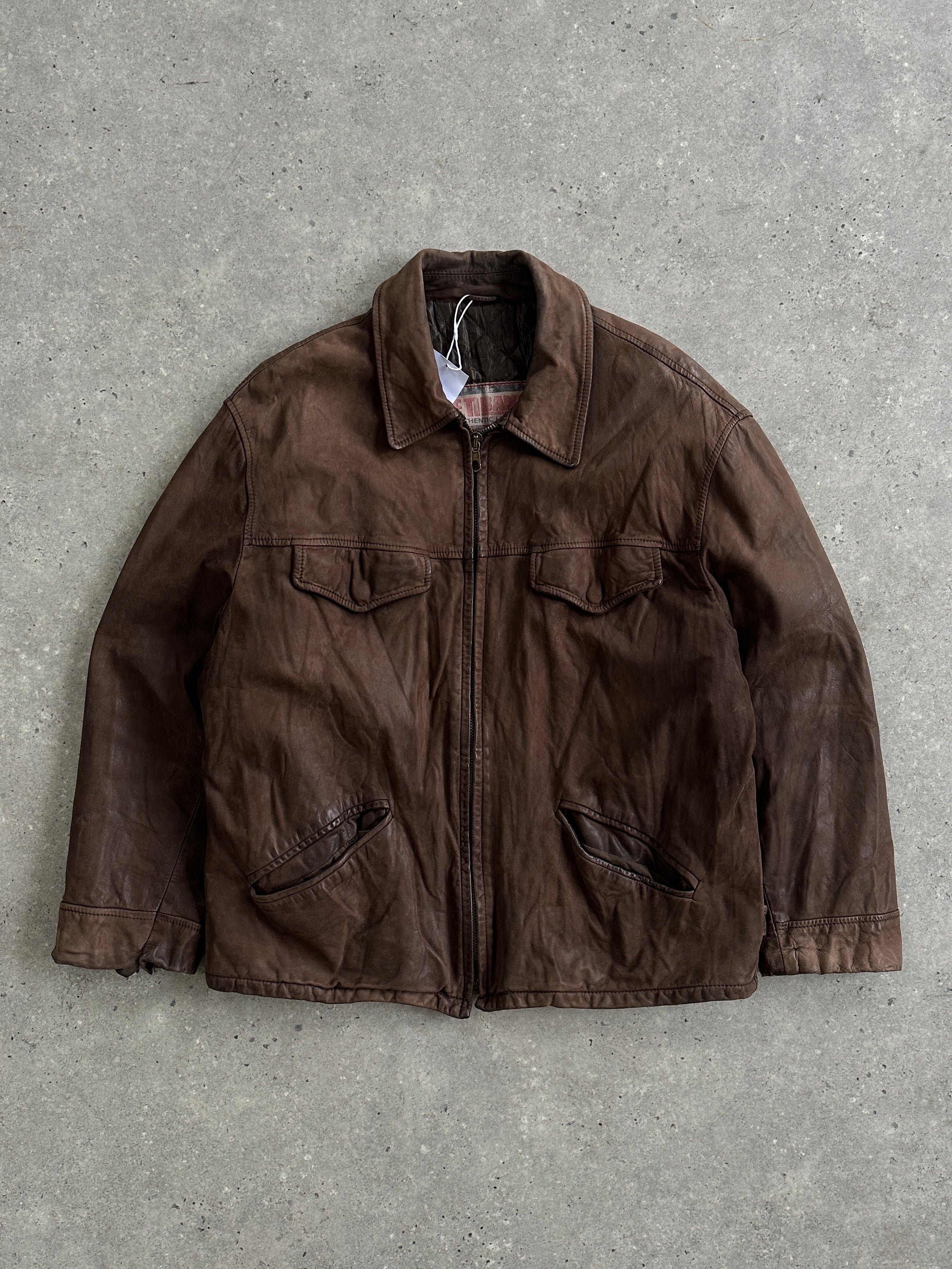 Vintage Italian leather jacket in nubuck with a zip-up front, size large, showcasing classic vintage style and soft textured leather.