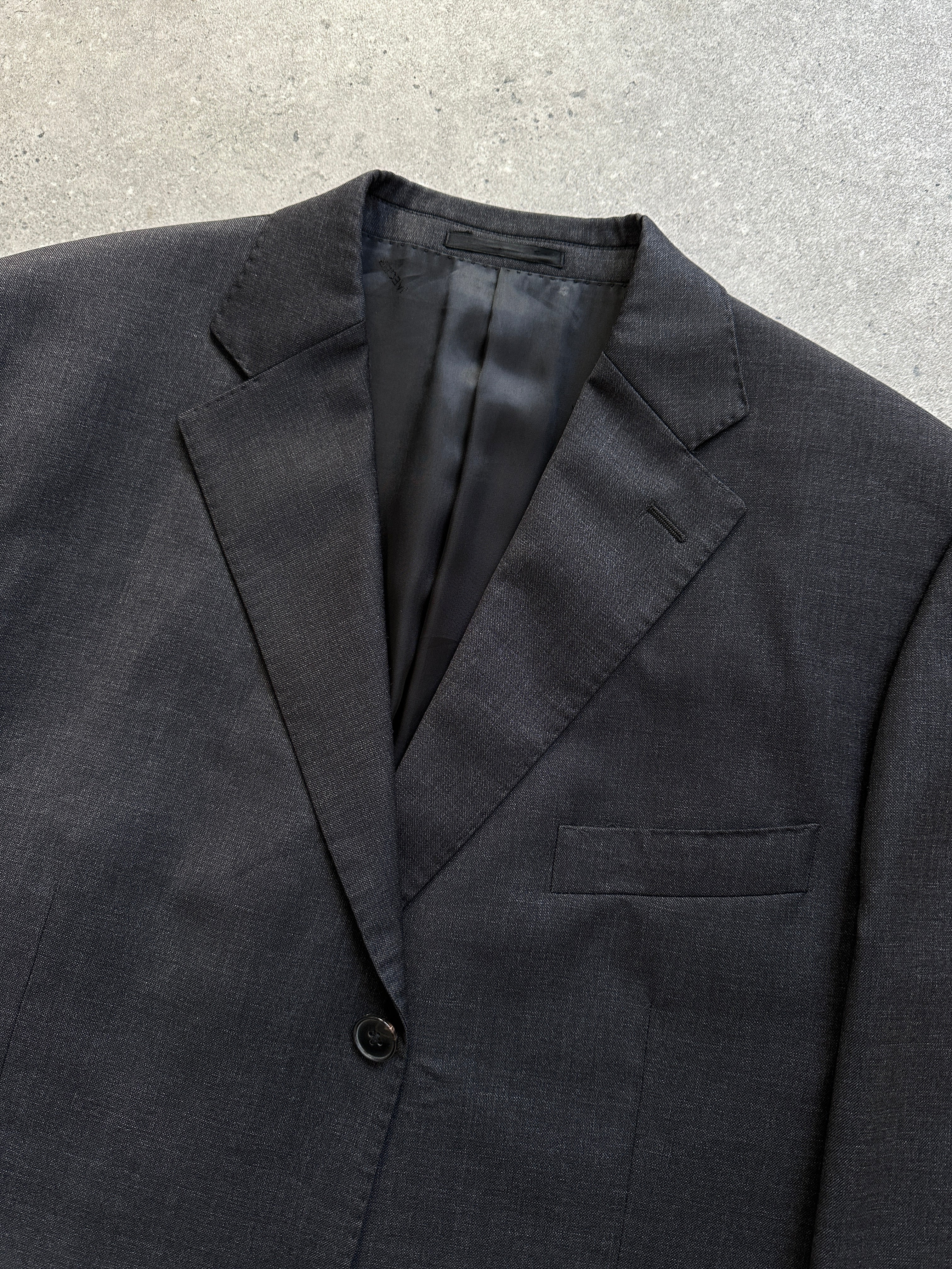 Jaeger single-breasted pure wool blazer in size 42R/L, tailored fit with notch lapels and classic design, shown on a hanger.