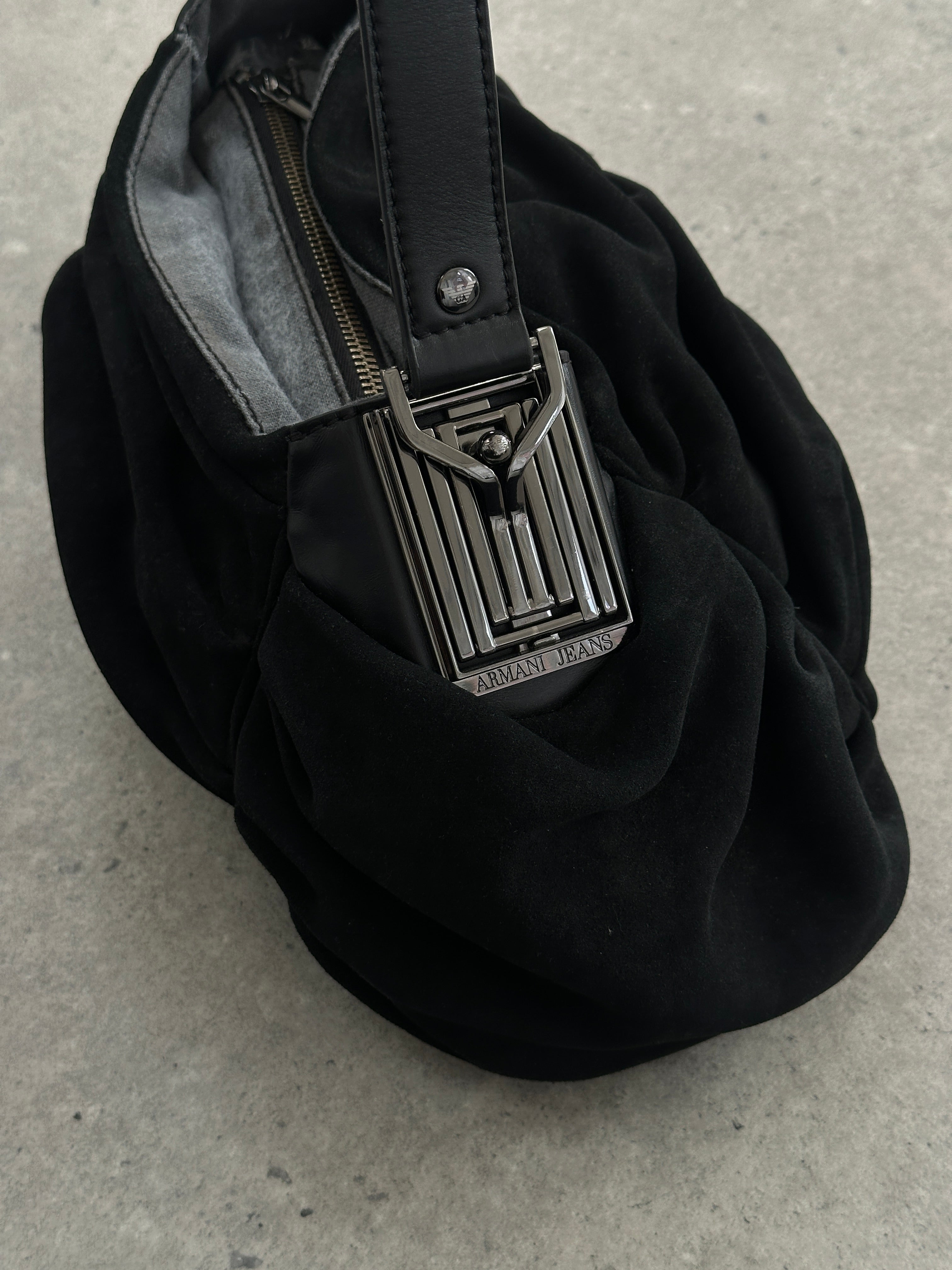 Armani Jeans suede ruched shoulder bag with a sleek design and adjustable strap, perfect for stylish everyday use.