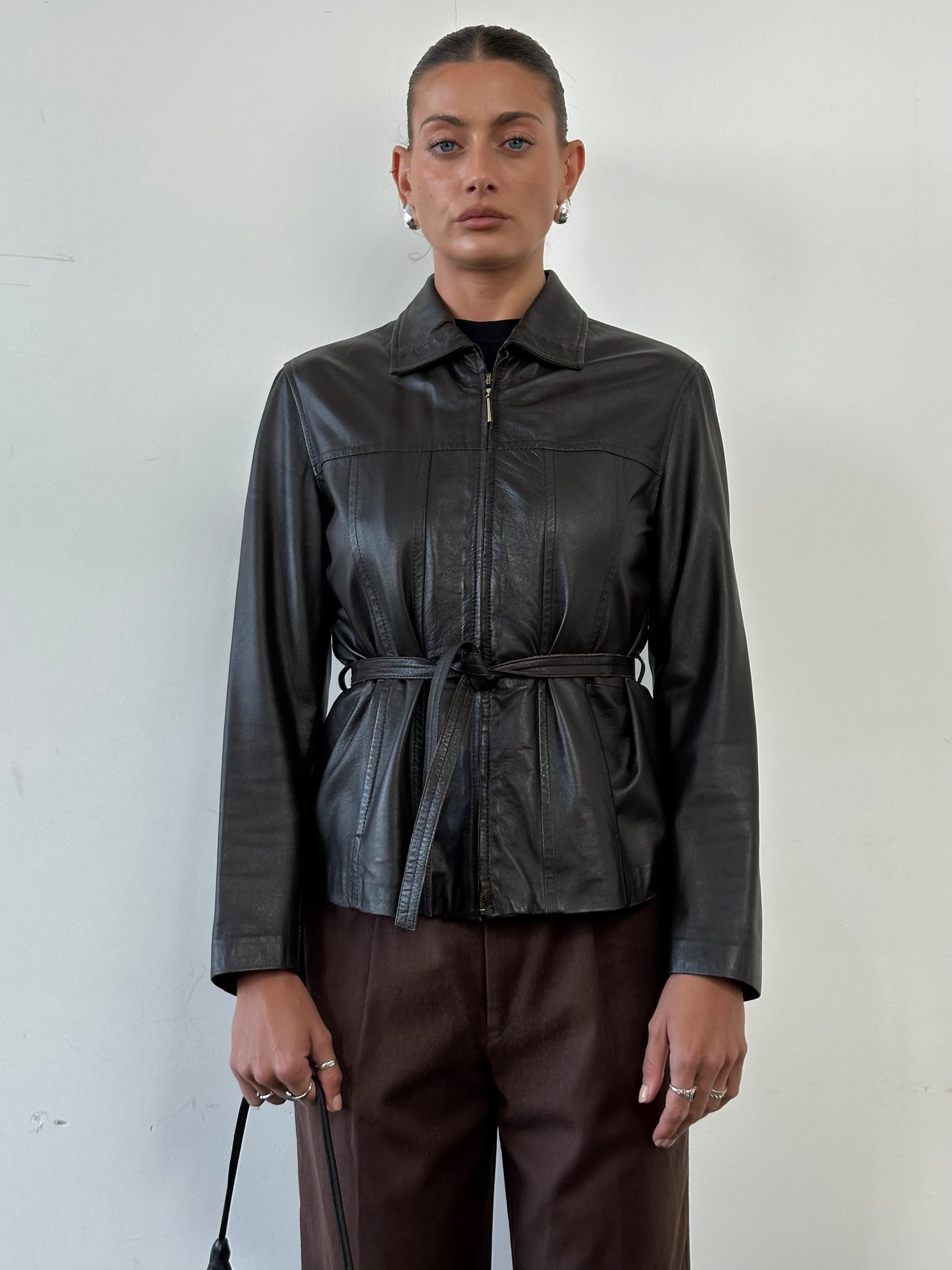 Giorgio Armani Black Label belted leather jacket in black with front zipper and stylish collar, size small/medium.