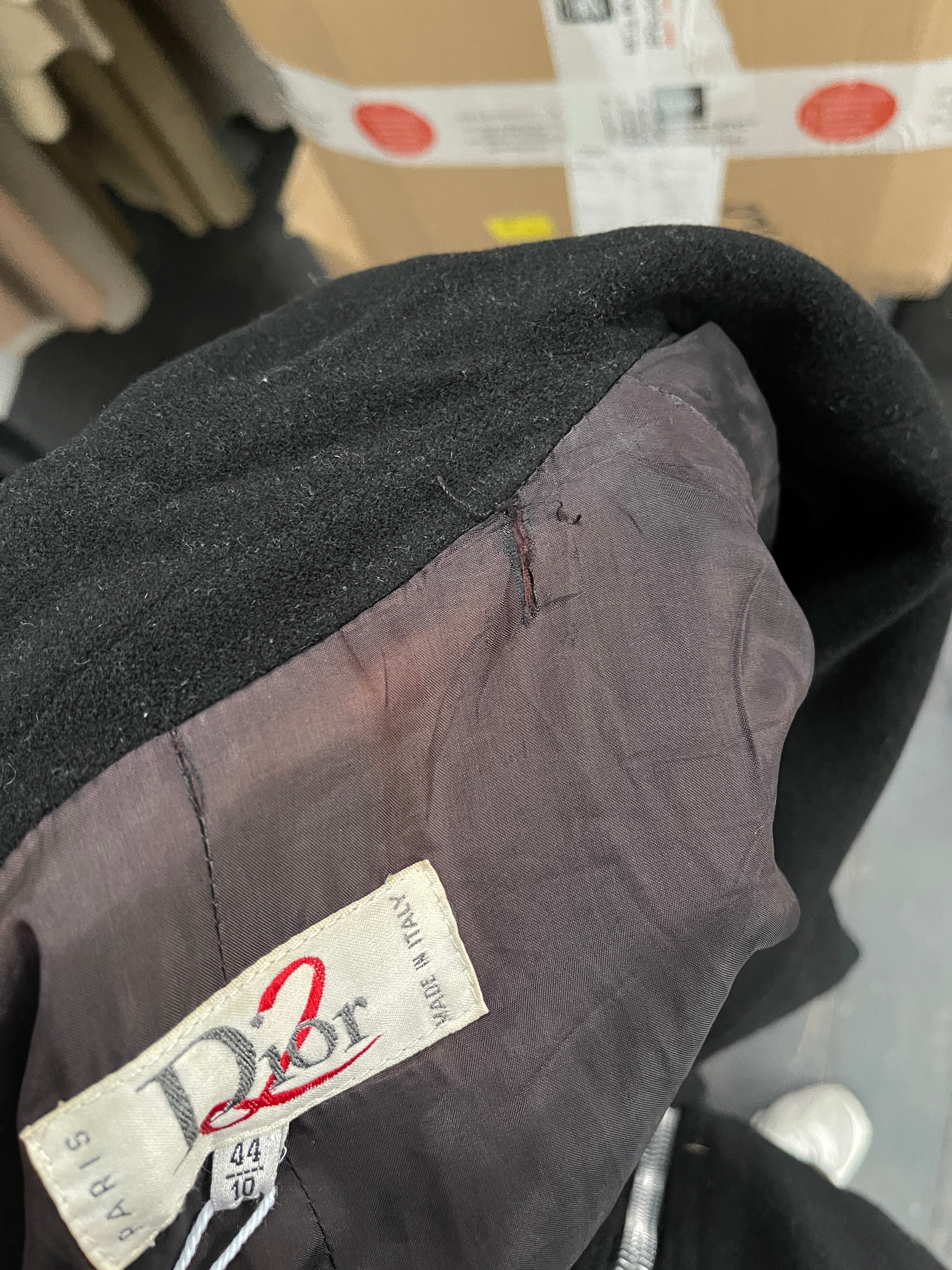 Christian Dior Dior2 1990s pure wool double-breasted coat in size M displayed on a hanger, showcasing classic design and tailored fit.
