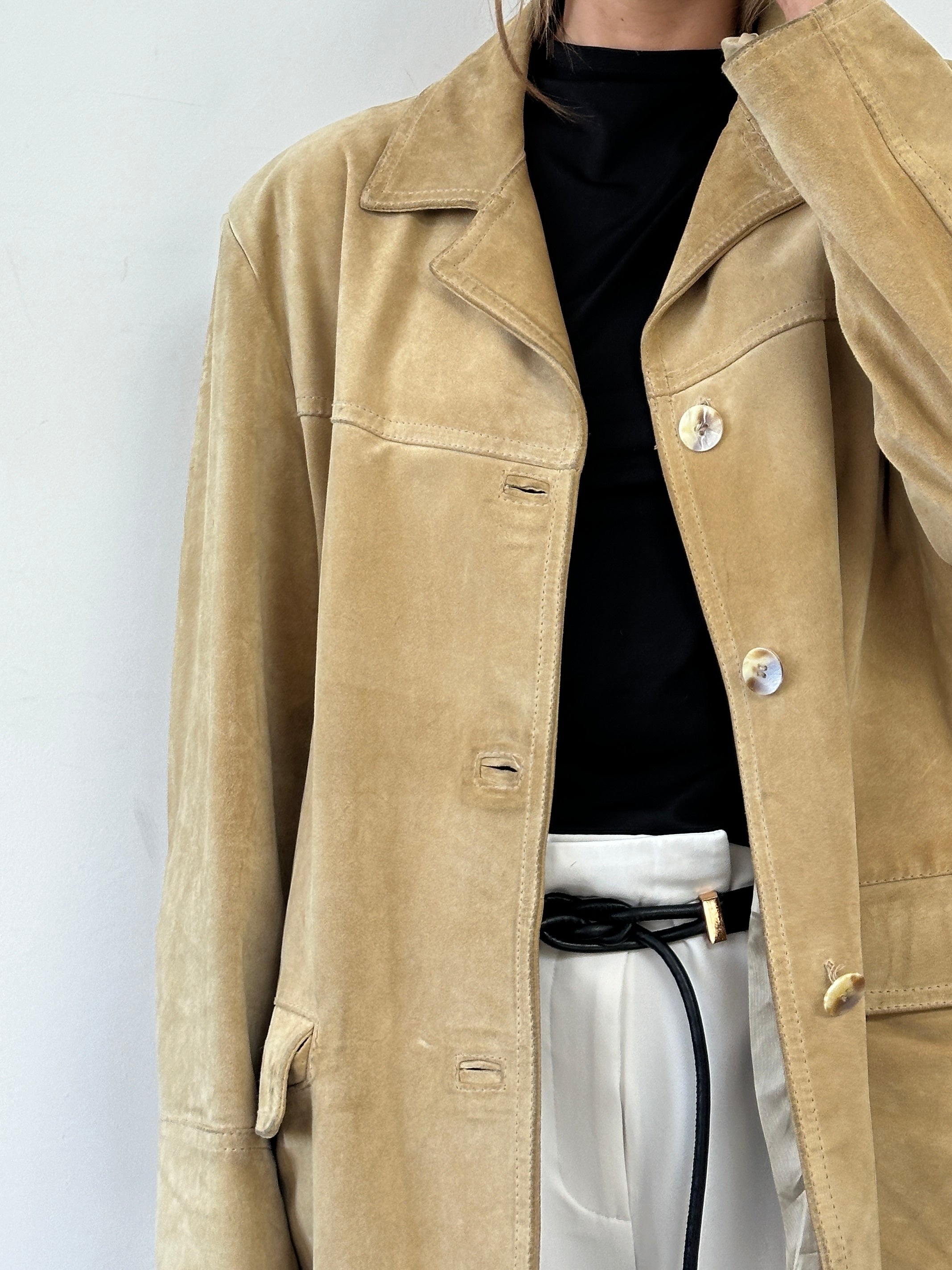 Vintage boxy suede jacket in size L/XL, featuring a classic design and soft texture, displayed on a hanger.