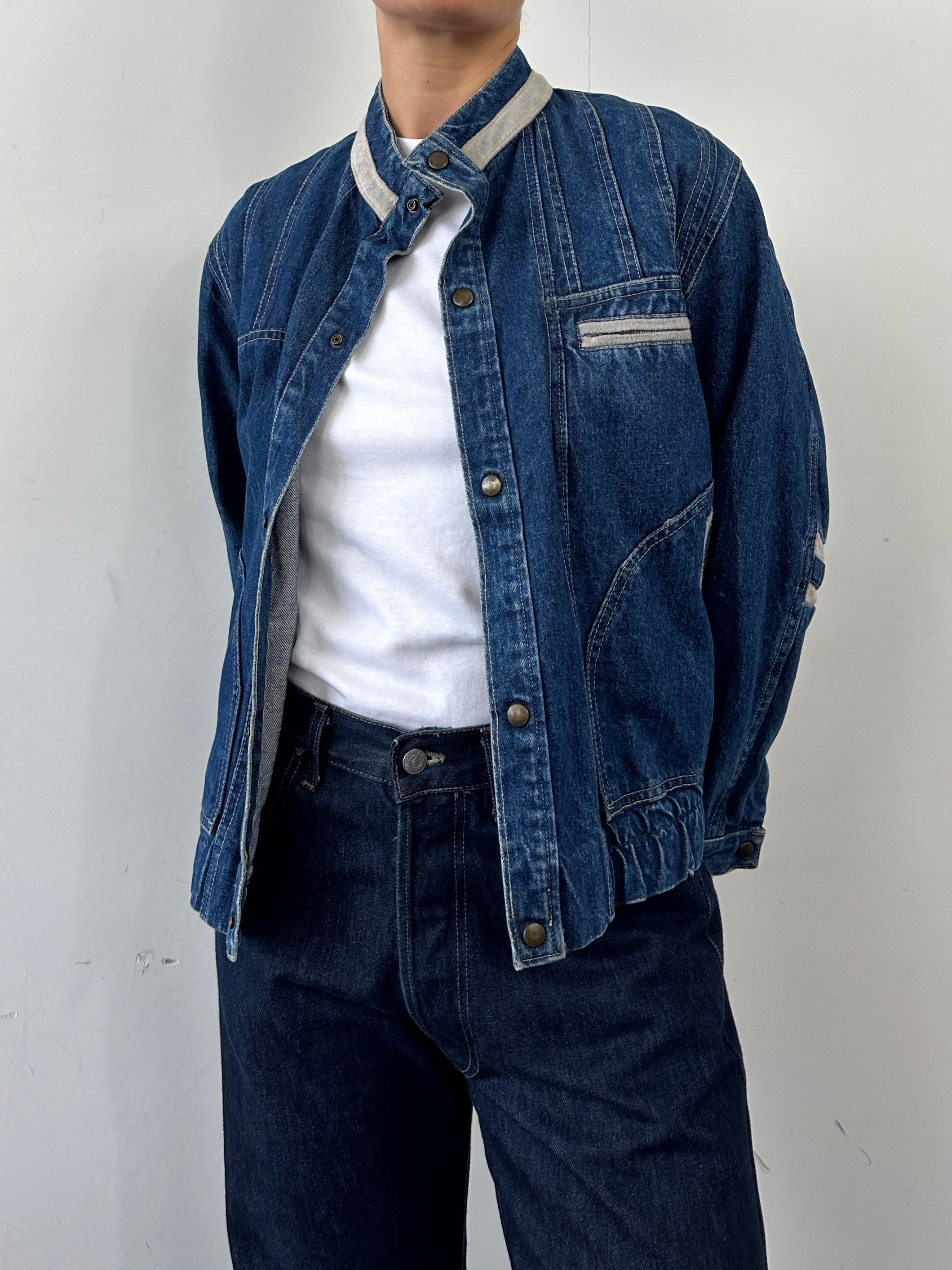 Vintage contrast stitch denim jacket in S/M size, featuring classic style and detailed stitching on durable denim fabric.
