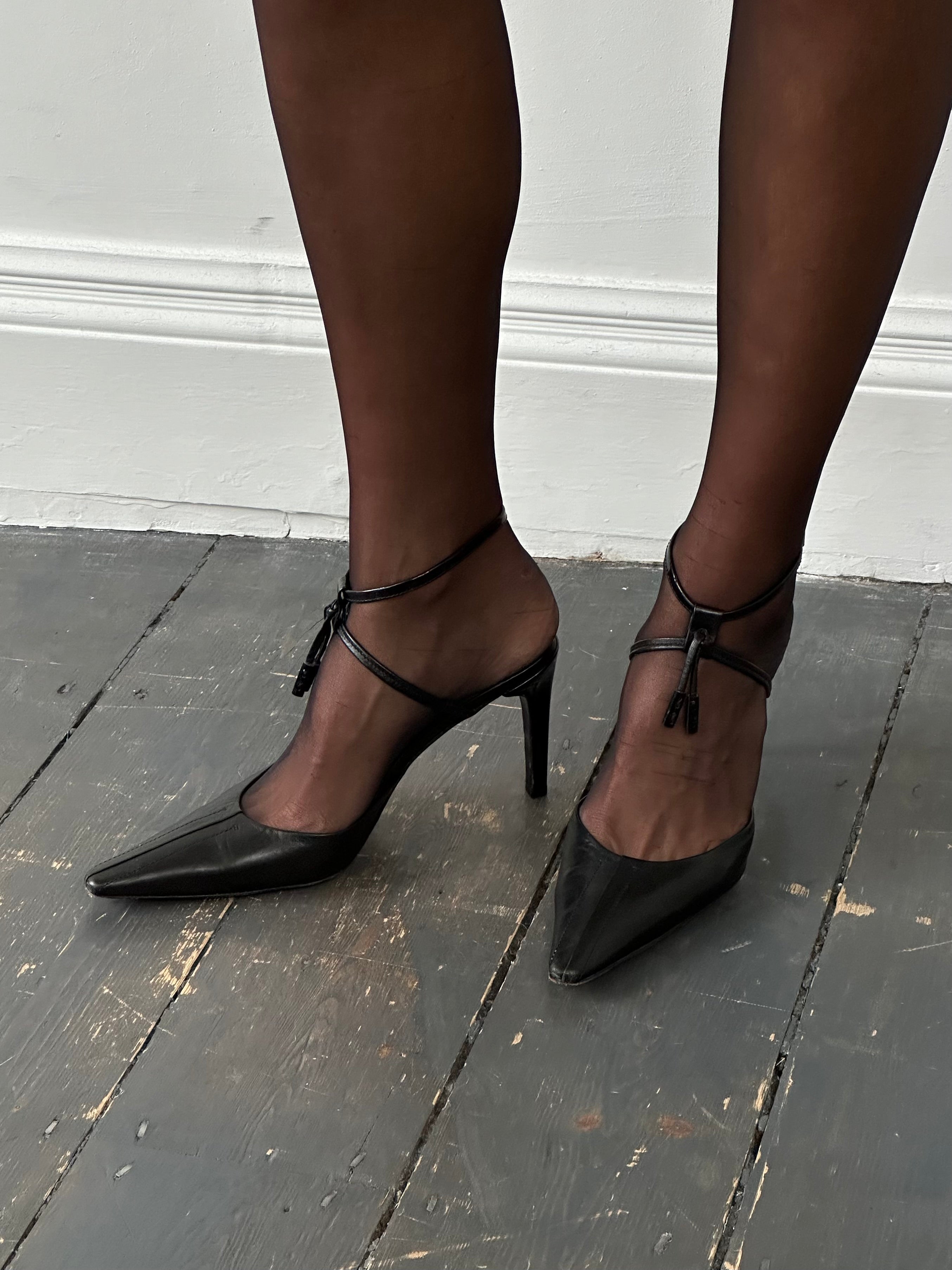 Prada pointed toe high heels in black leather, UK size 7.5, stylish and elegant footwear for formal or special occasions.