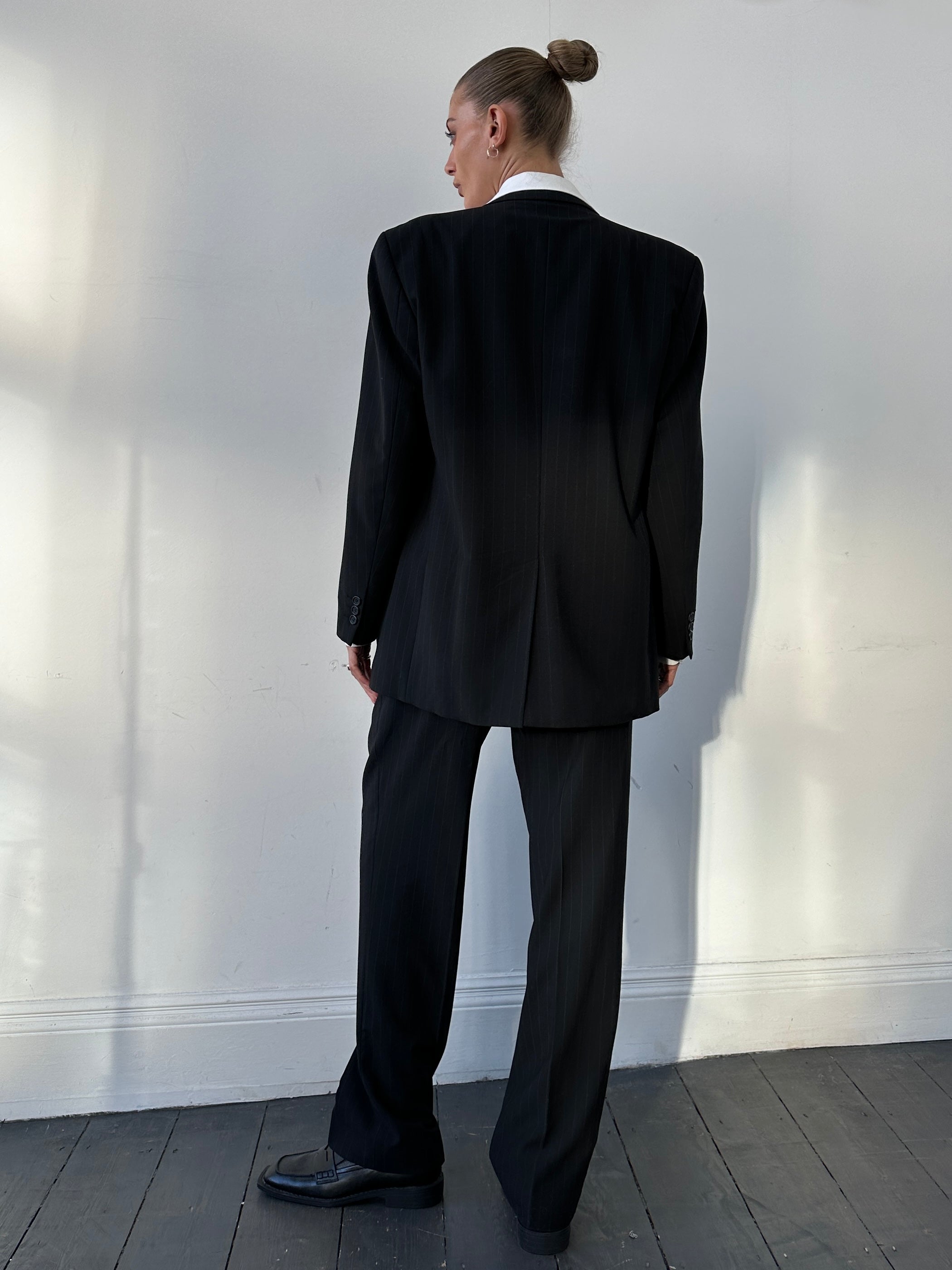 Vintage pinstripe wool three-piece suit, size 40R/W32, shown on a mannequin with jacket, vest, and trousers in a classic fit.