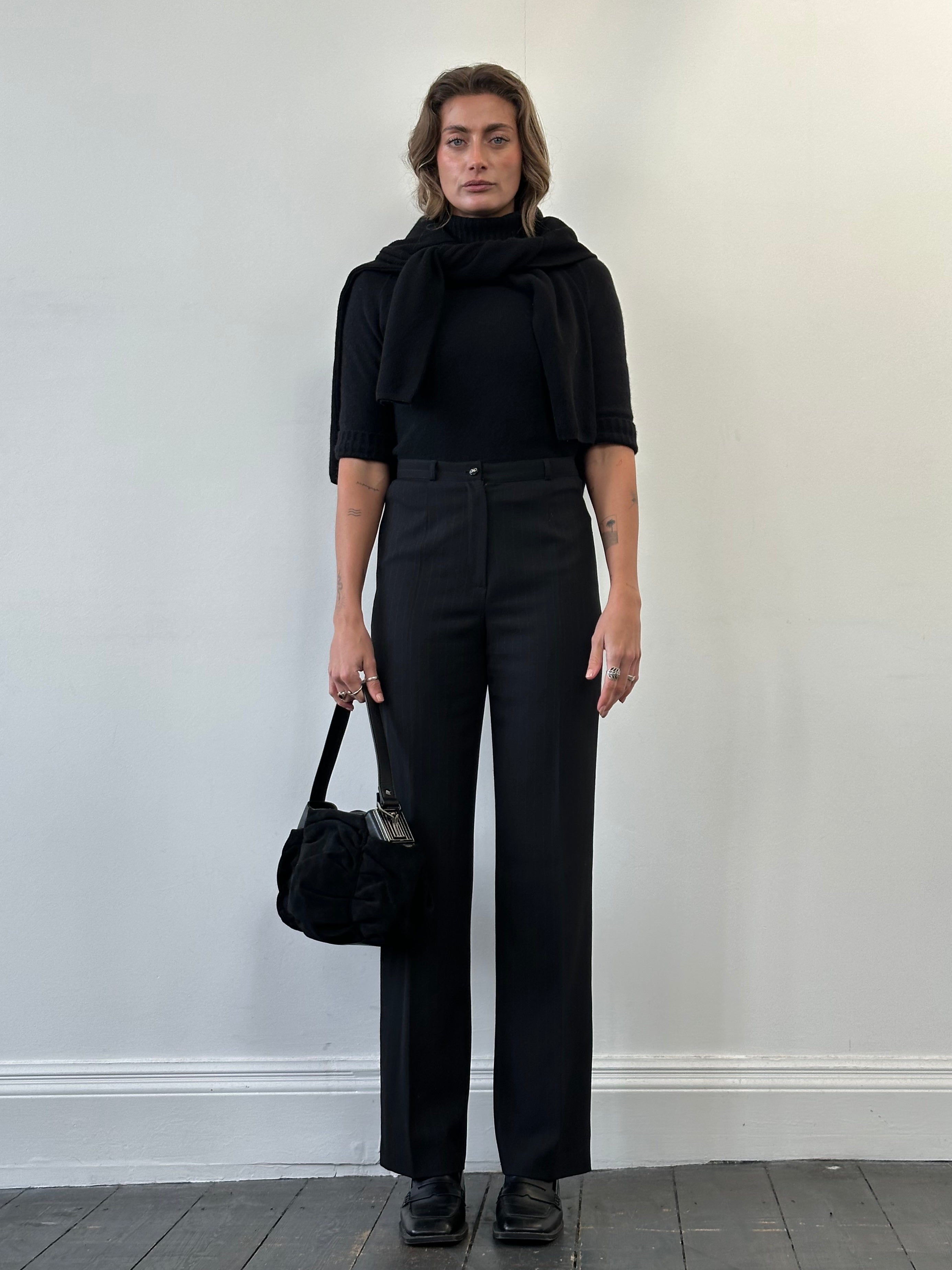 Salvatore Ferragamo high-waisted tailored trousers in wool with stripe pattern, front view showcasing fit and design details.