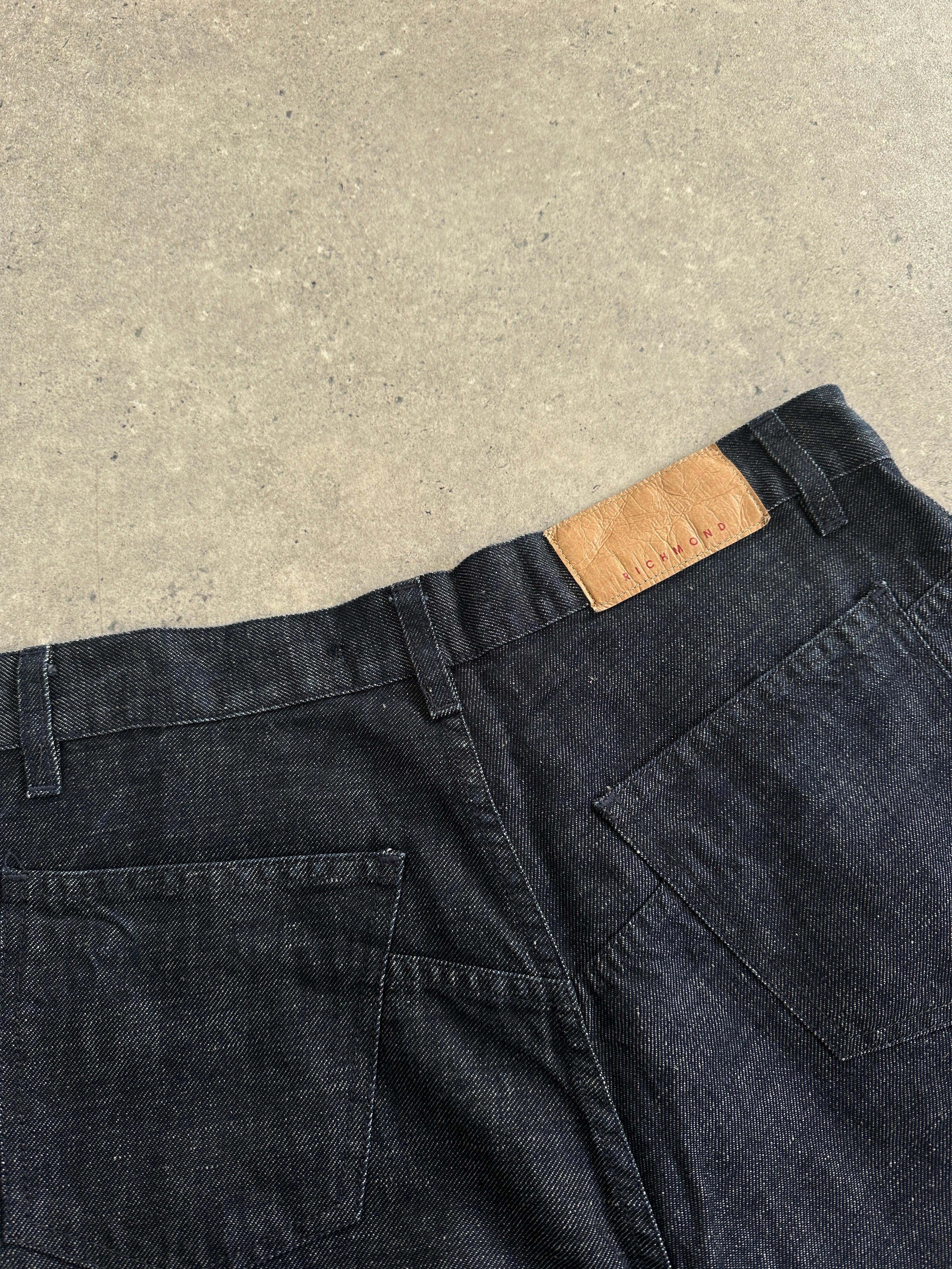 Richmond Italian high-waisted wide-leg denim jeans in size W31, shown on a model with a classic blue wash and relaxed fit.