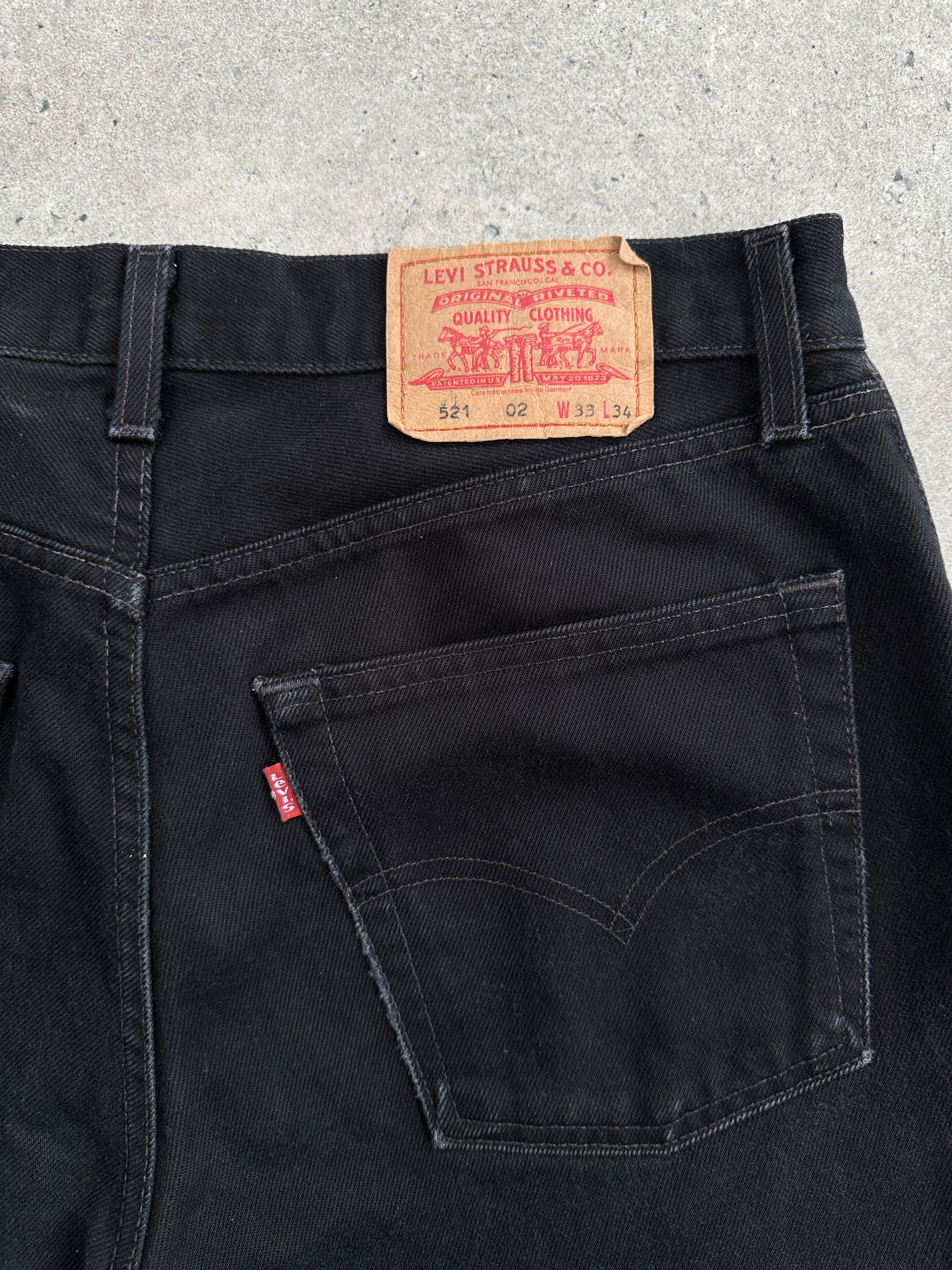 Levi’s 521 tapered straight leg denim jeans in W31, showing the classic blue denim fabric and fitted style.