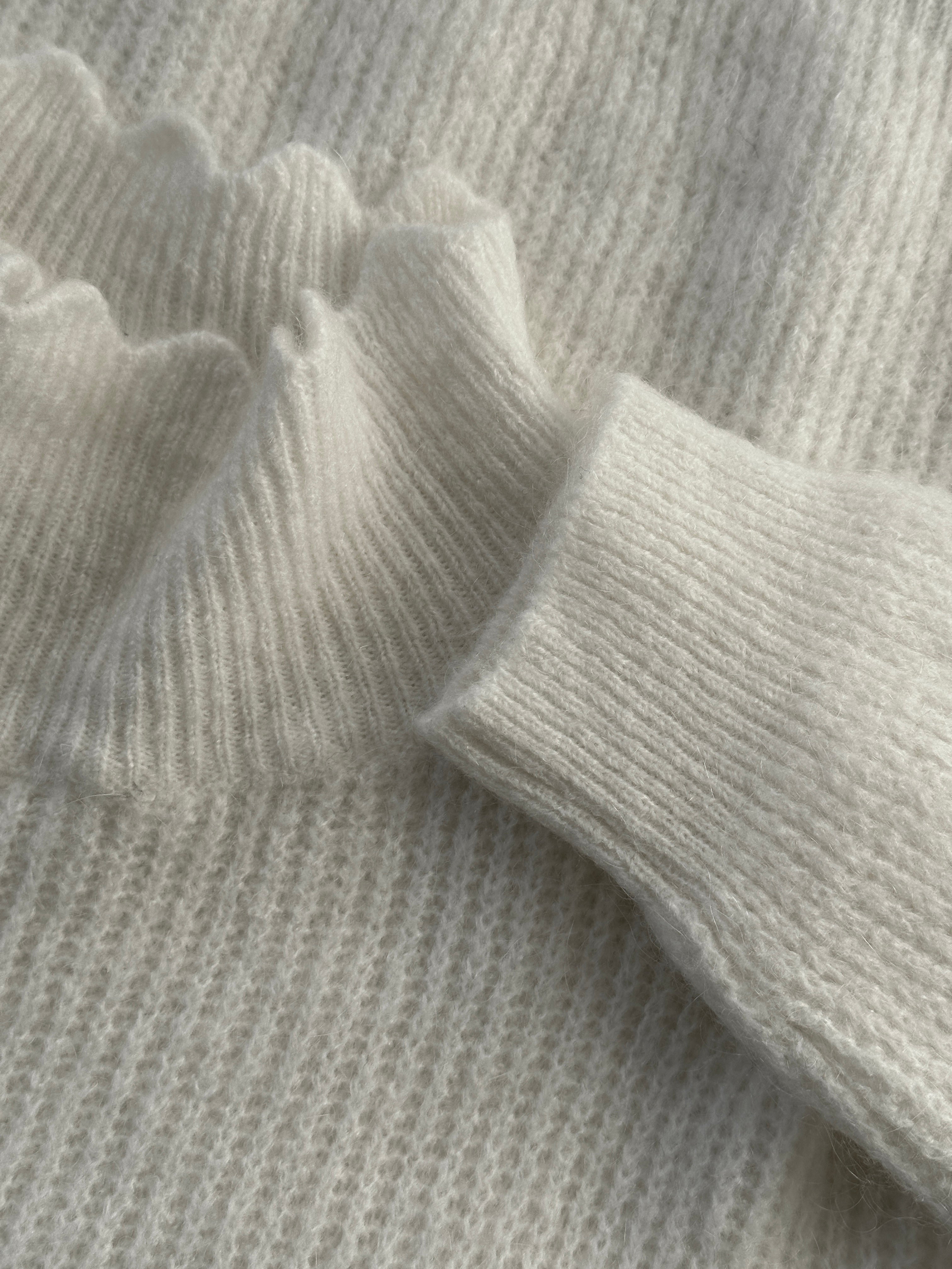 Vintage Italian mohair scalloped knitted jumper in size M, showcasing its soft, textured fabric and stylish scalloped neckline.