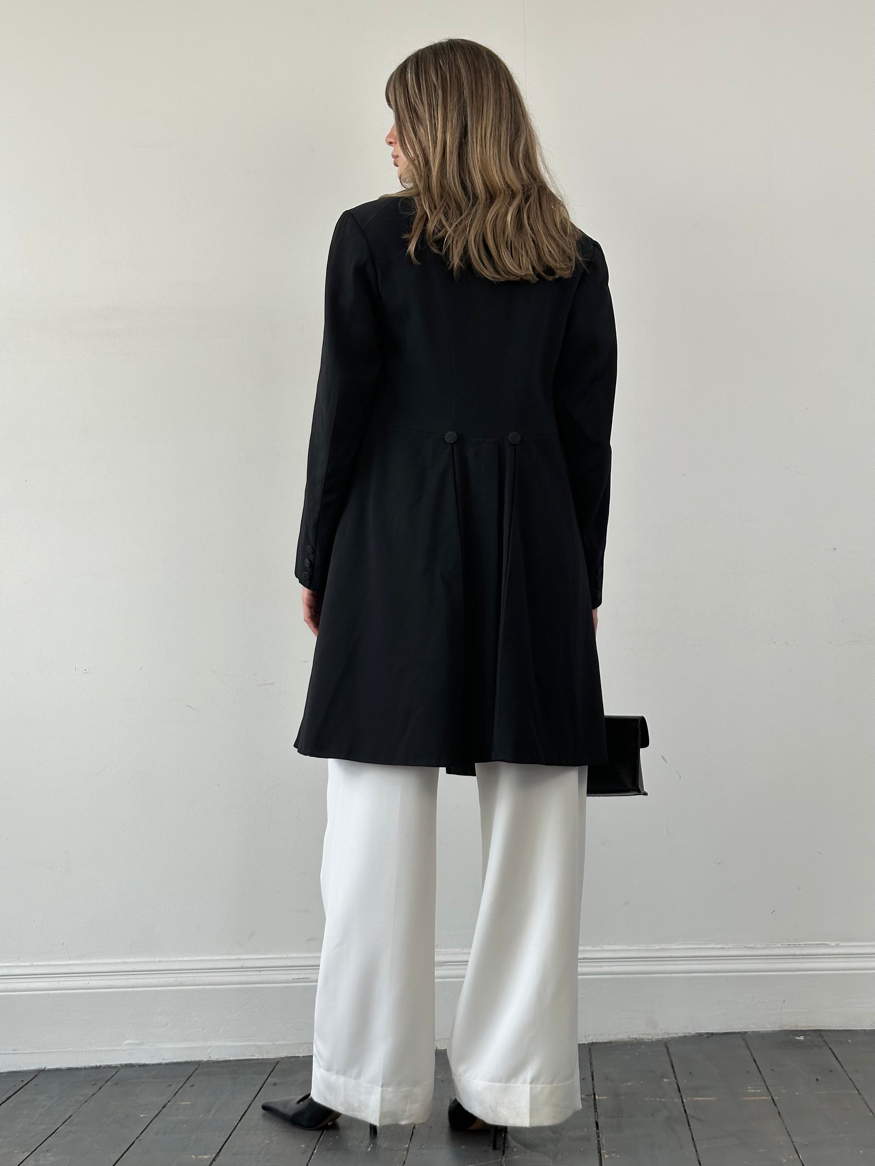 Vintage tuxedo coat in size M/L, classic black formal coat with satin lapels, tailored fit, and vintage style.
