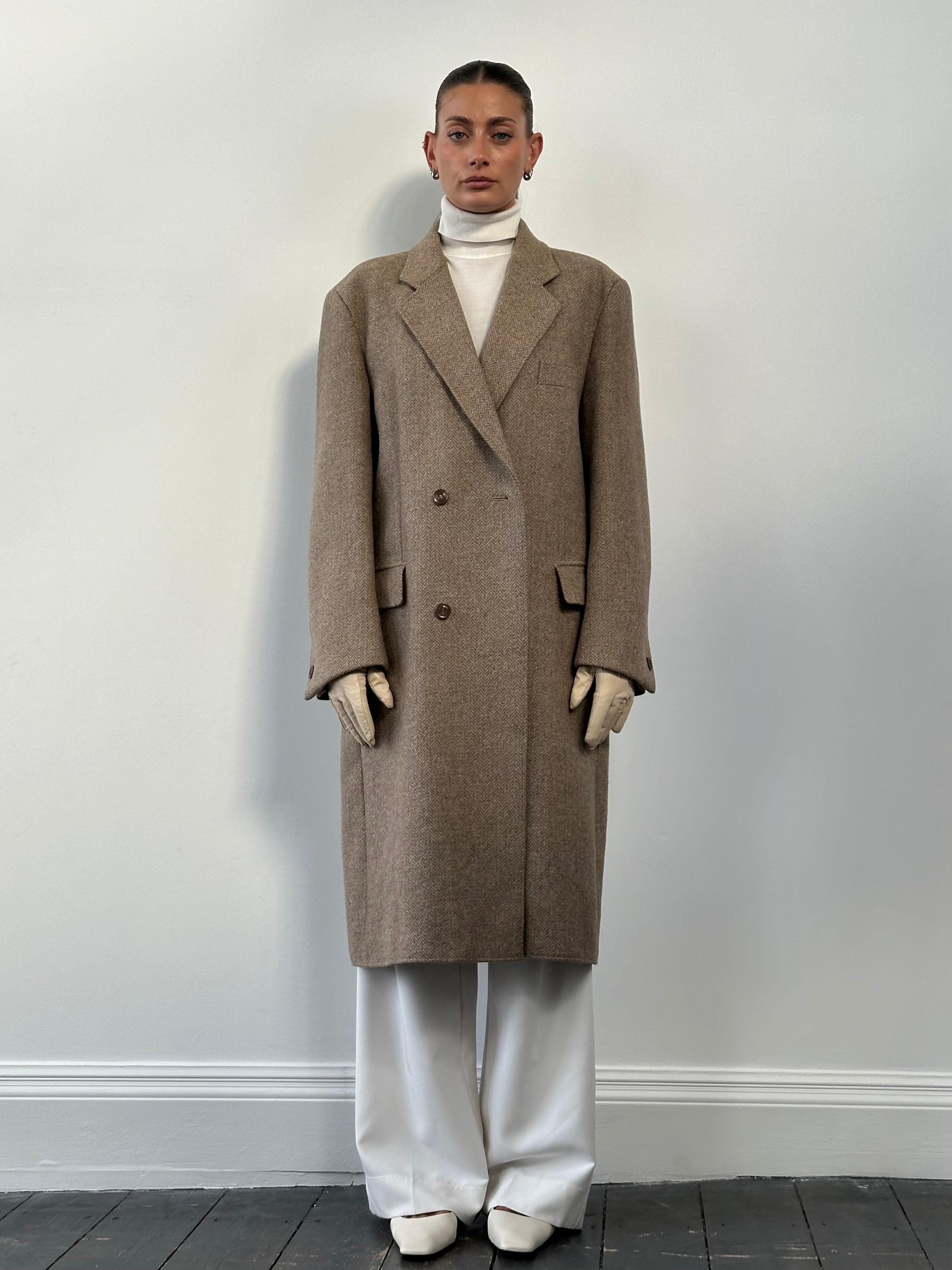 Vintage wool herringbone double-breasted coat in size XL, showcasing classic pattern, tailored fit, and traditional style.