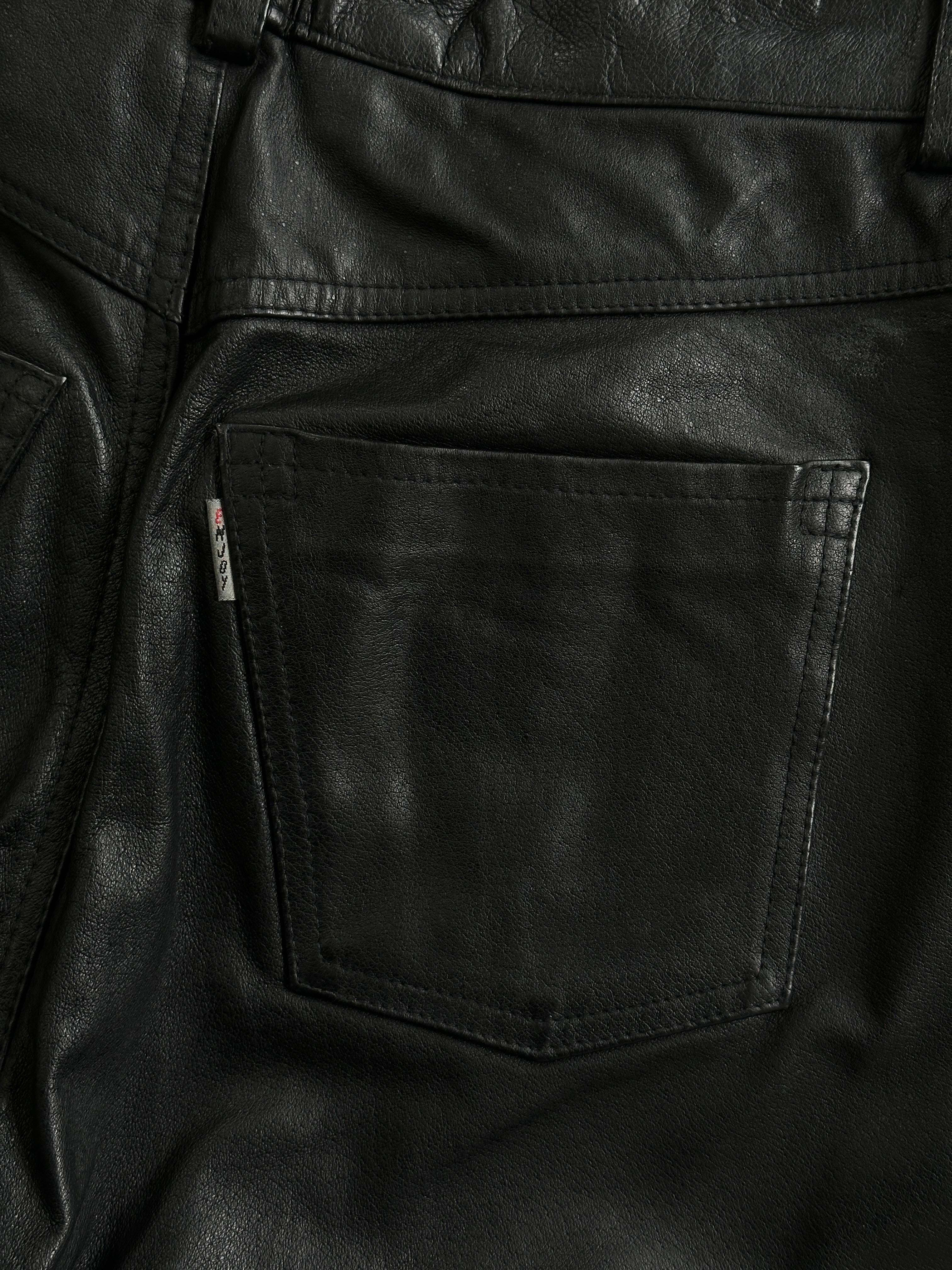 Vintage straight-leg leather trousers in size W30, featuring classic design and smooth leather finish.