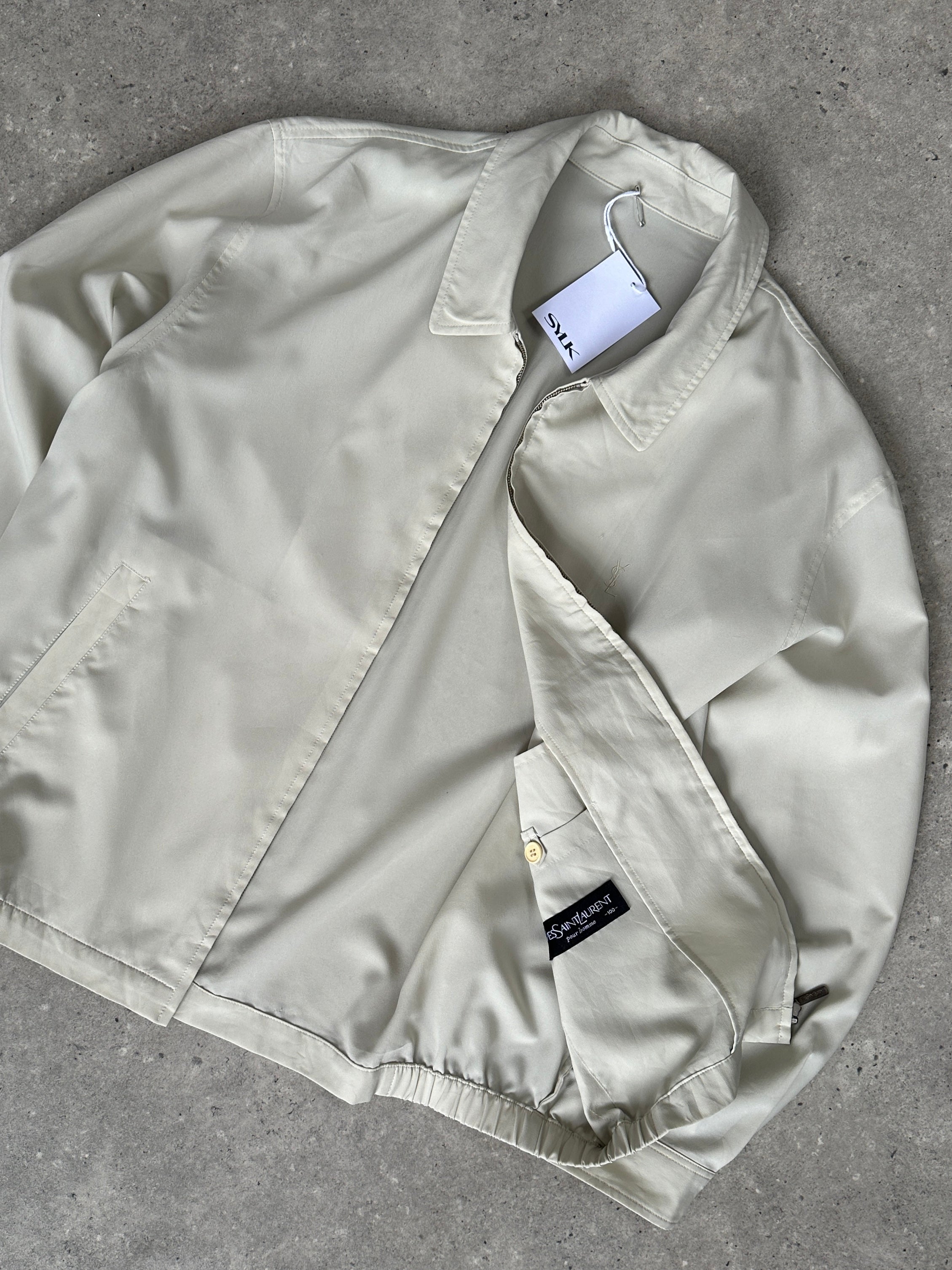 Yves Saint Laurent Pour Homme lightweight logo bomber jacket in black, with YSL branding on the chest and ribbed cuffs.