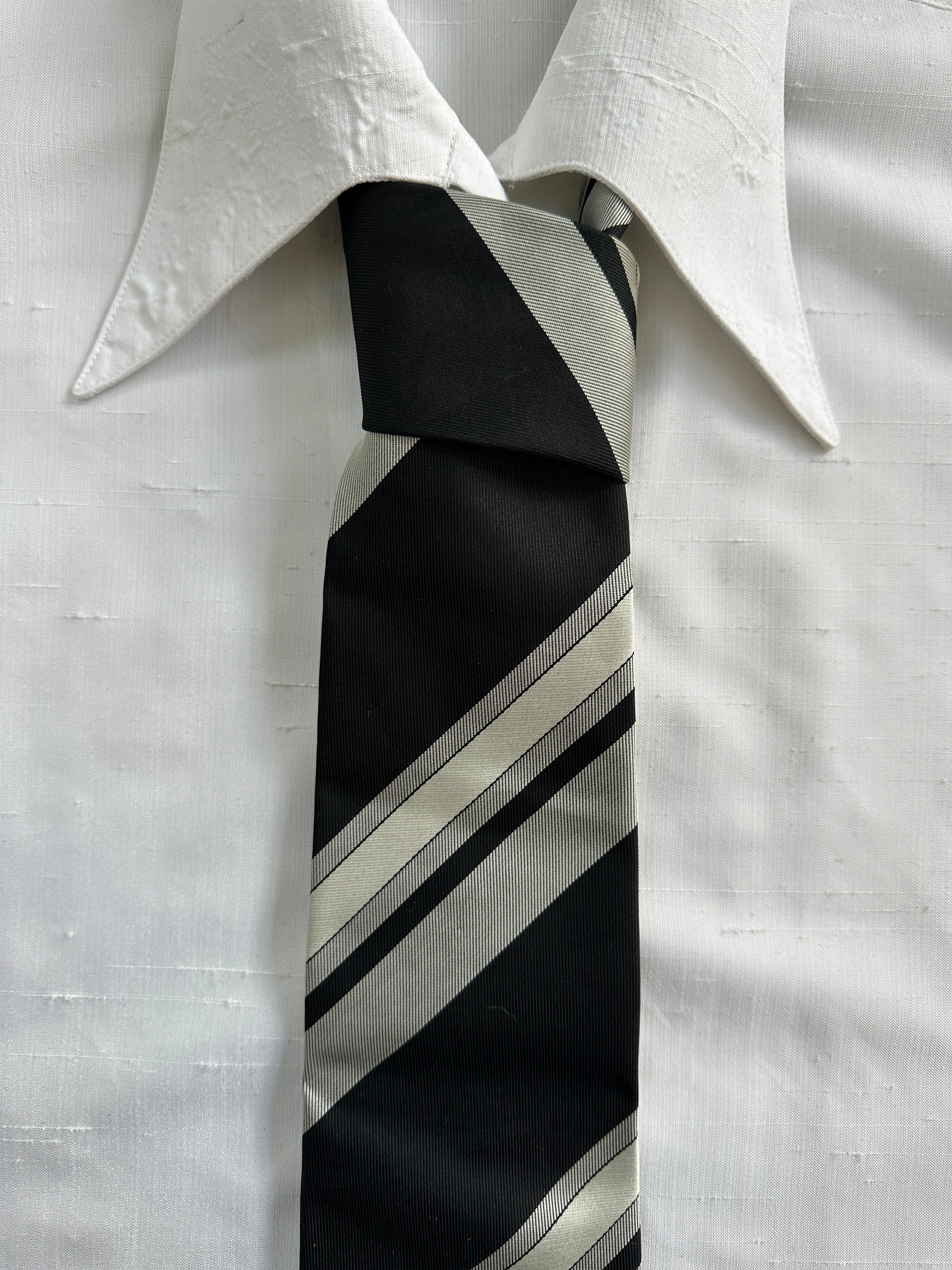Vintage Japanese 1990s pure silk diagonal striped tie, showcasing elegant craftsmanship and classic design.