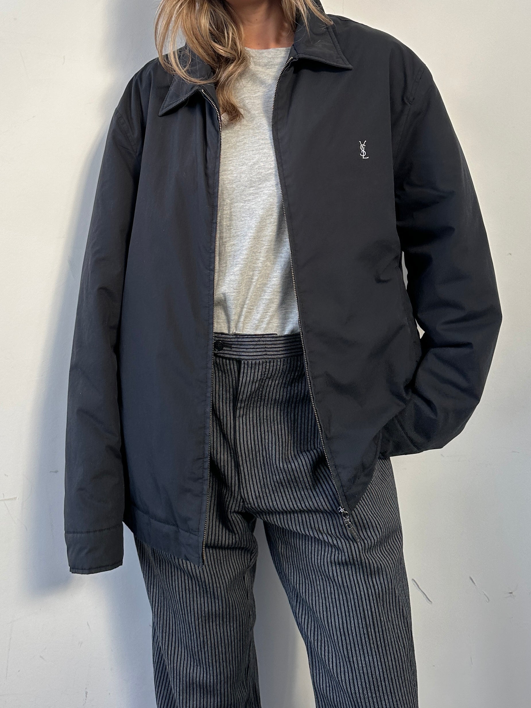 Yves Saint Laurent Harrington jacket in XXL, stylish black jacket with silver hardware and classic design, front view.