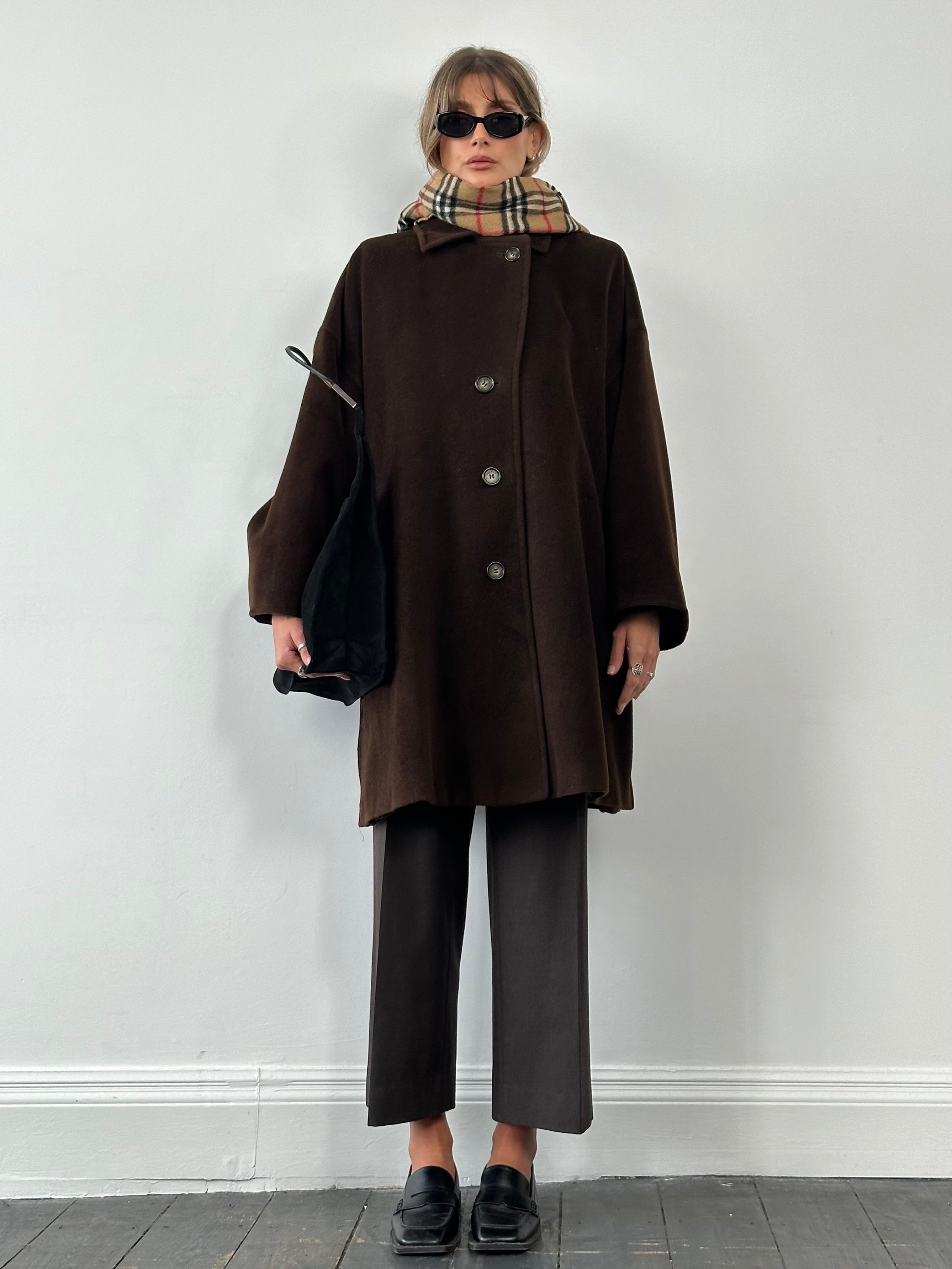 Max Mara pure virgin wool A-line coat in XL, shown hanging with front view and tailored design.