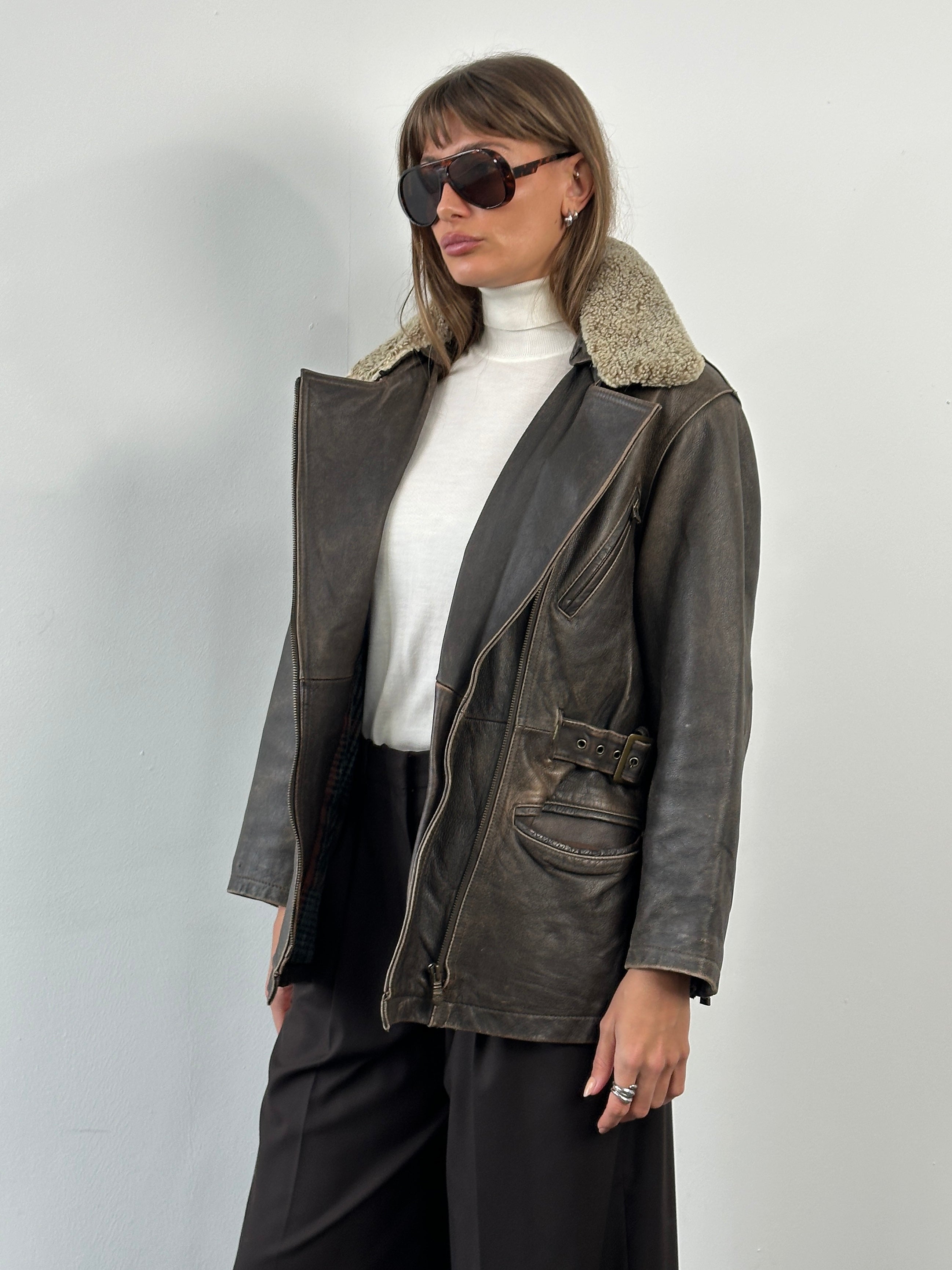 Vintage 1990s aged aviator leather jacket, size M, featuring worn brown leather, classic collar, and vintage-style stitching.