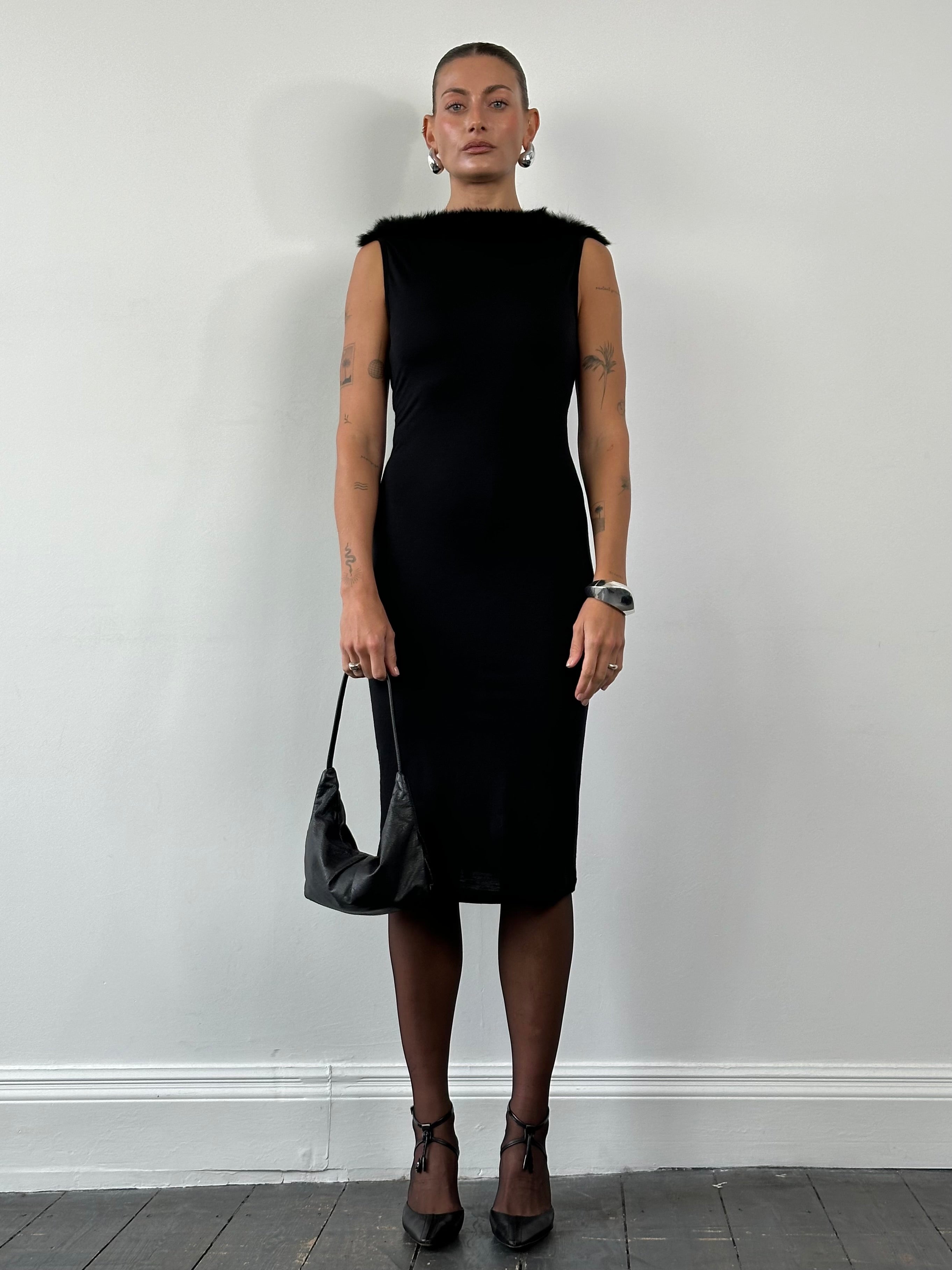 Moschino 1990s feather trim boat neck midi dress in black, featuring a fitted silhouette and elegant feather details at the neckline.