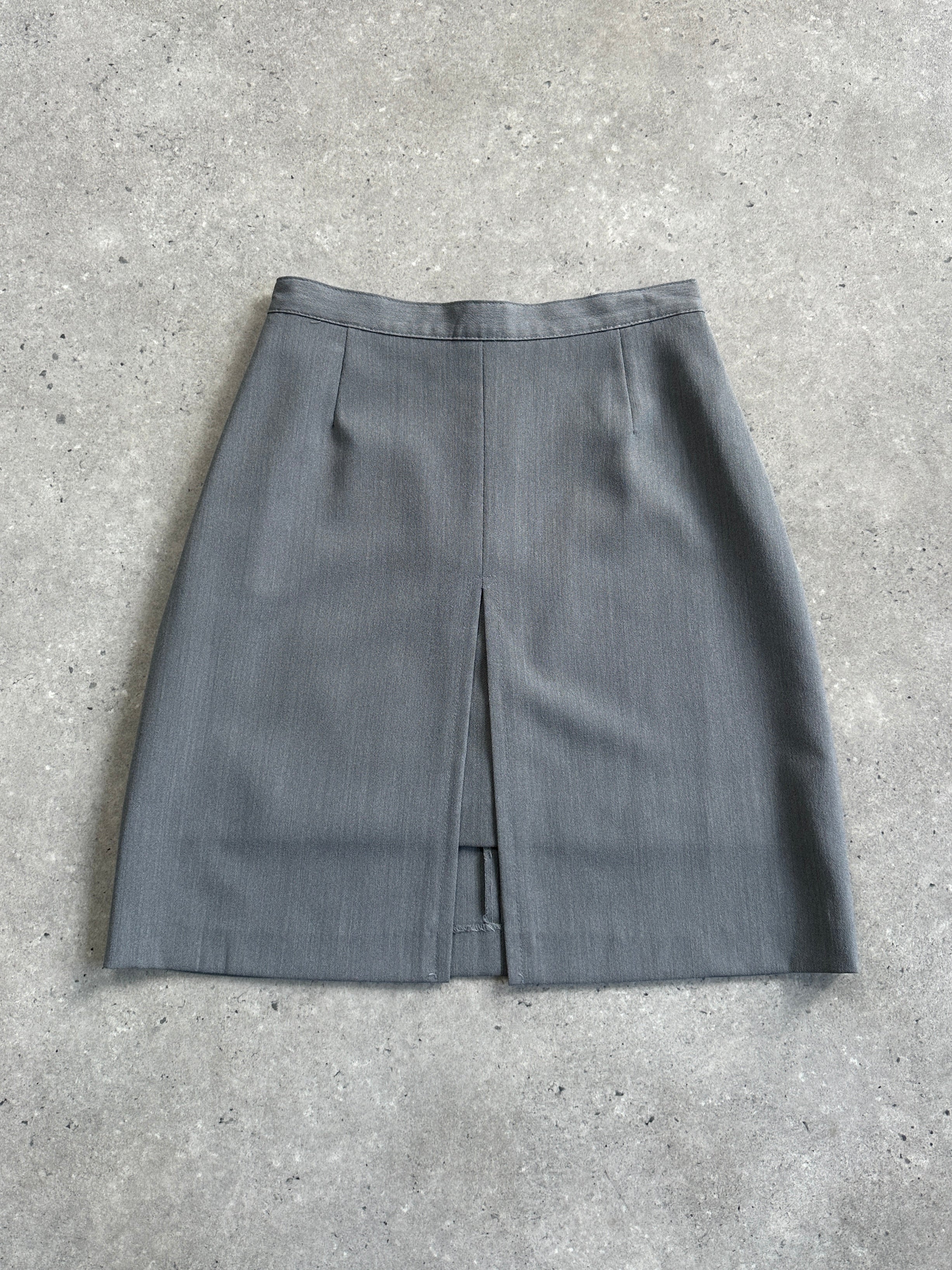 Vintage Italian double layered front split mini skirt with a stylish design, shown in the image.