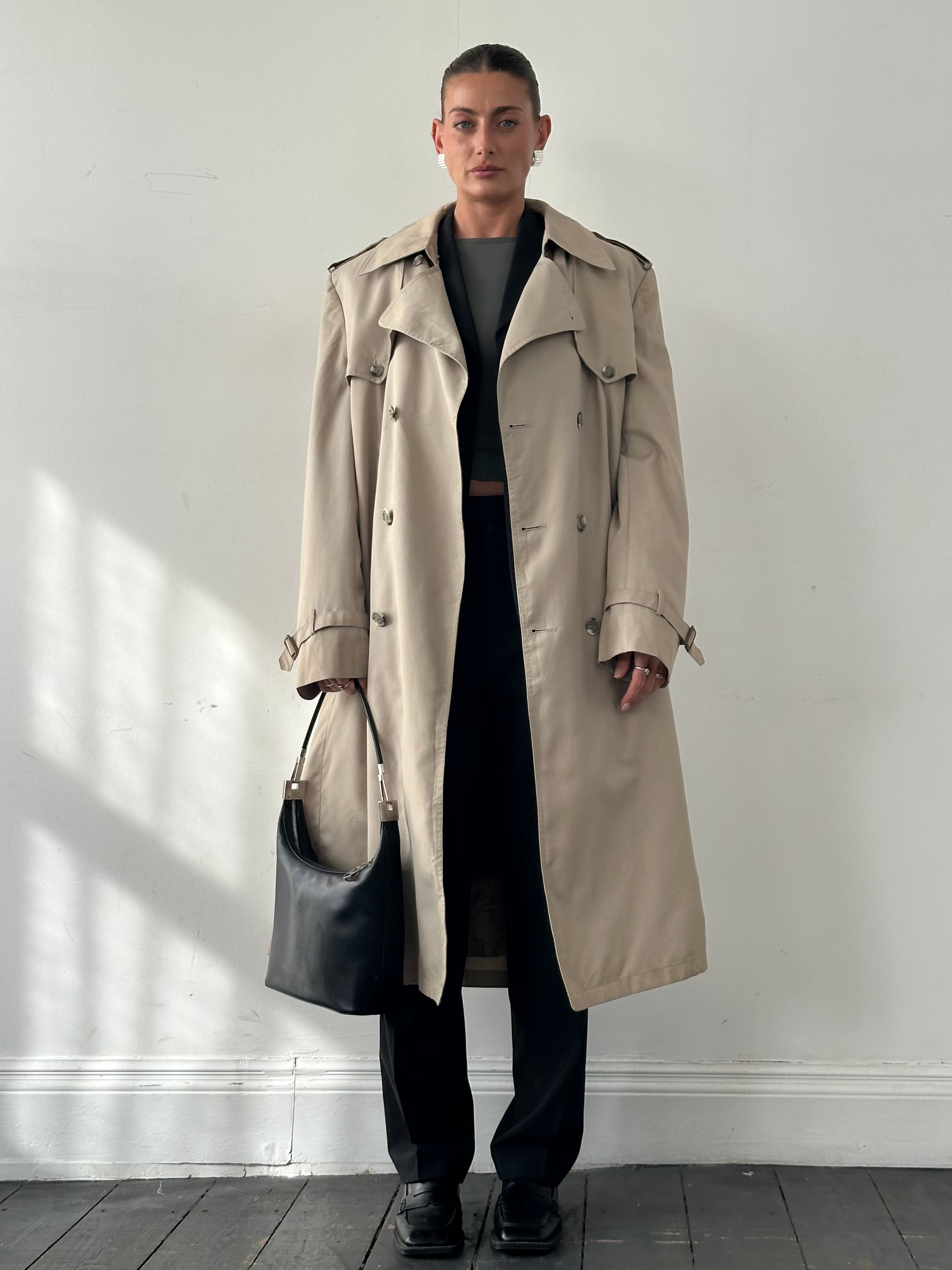 Christian Dior double-breasted trench coat in XL/XXL, beige color, tailored fit, with classic lapels and belt, shown on a hanger
